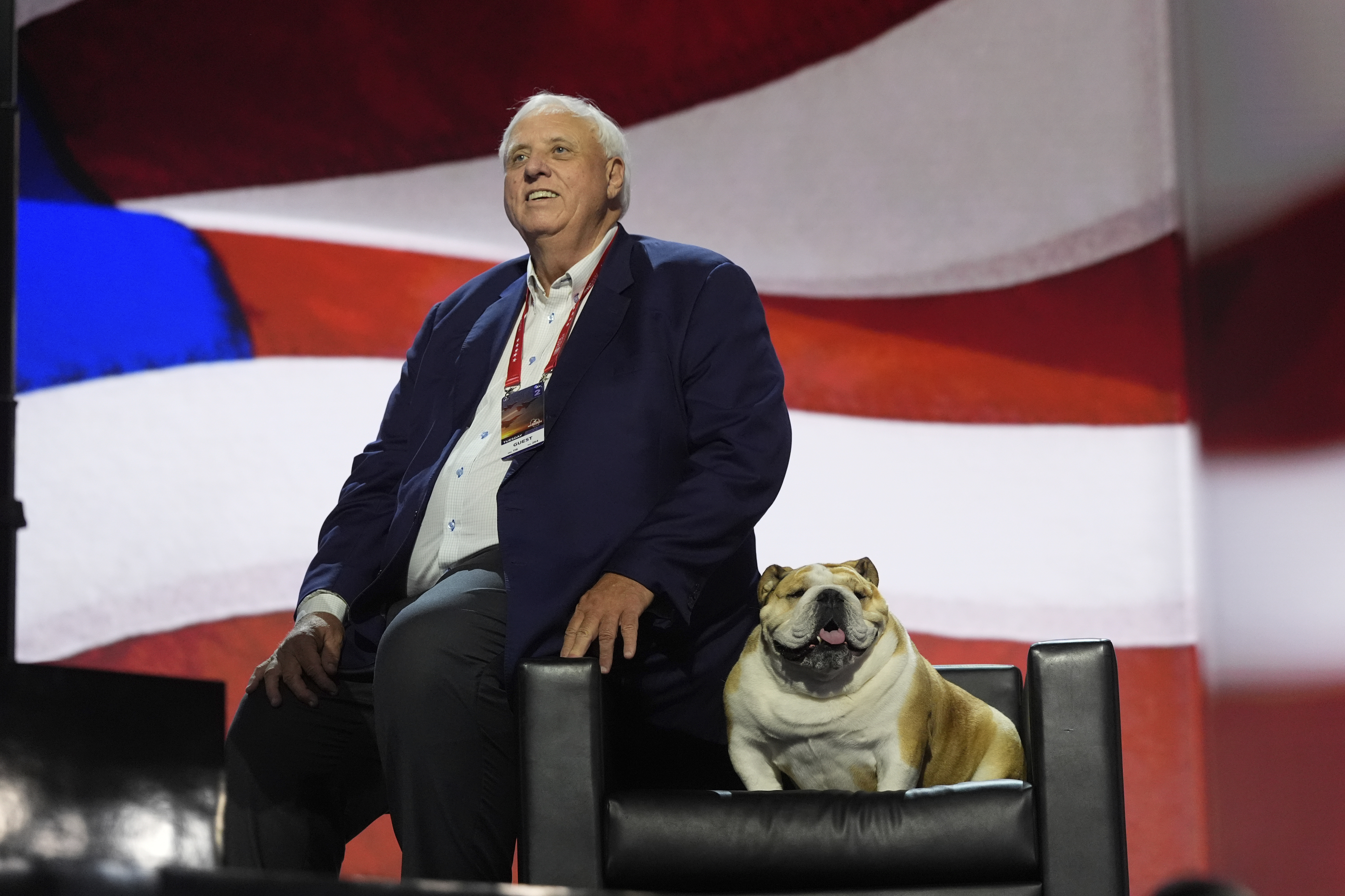 FILE - West Virginia Gov. Jim Justice checks out the stage with his dog, "Babydog," before the Republican National Convention, July 16, 2024, in Milwaukee. (AP Photo/Jae C. Hong, File)