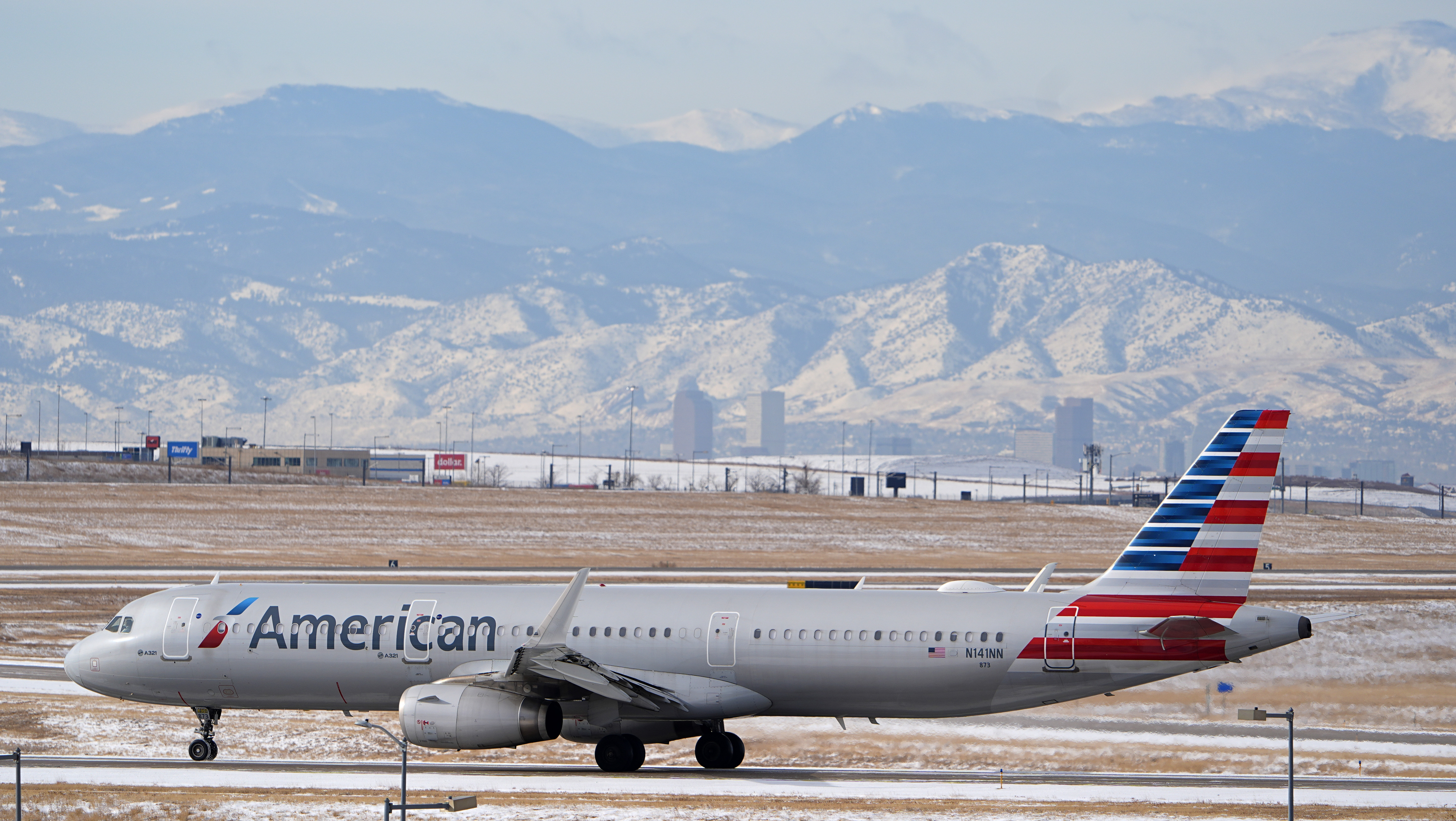 FILE - An American Airlines jetliner rumbles down a runway at Denver International Airport, Jan. 16, 2024, in Denver. (AP Photo/David Zalubowski, File)