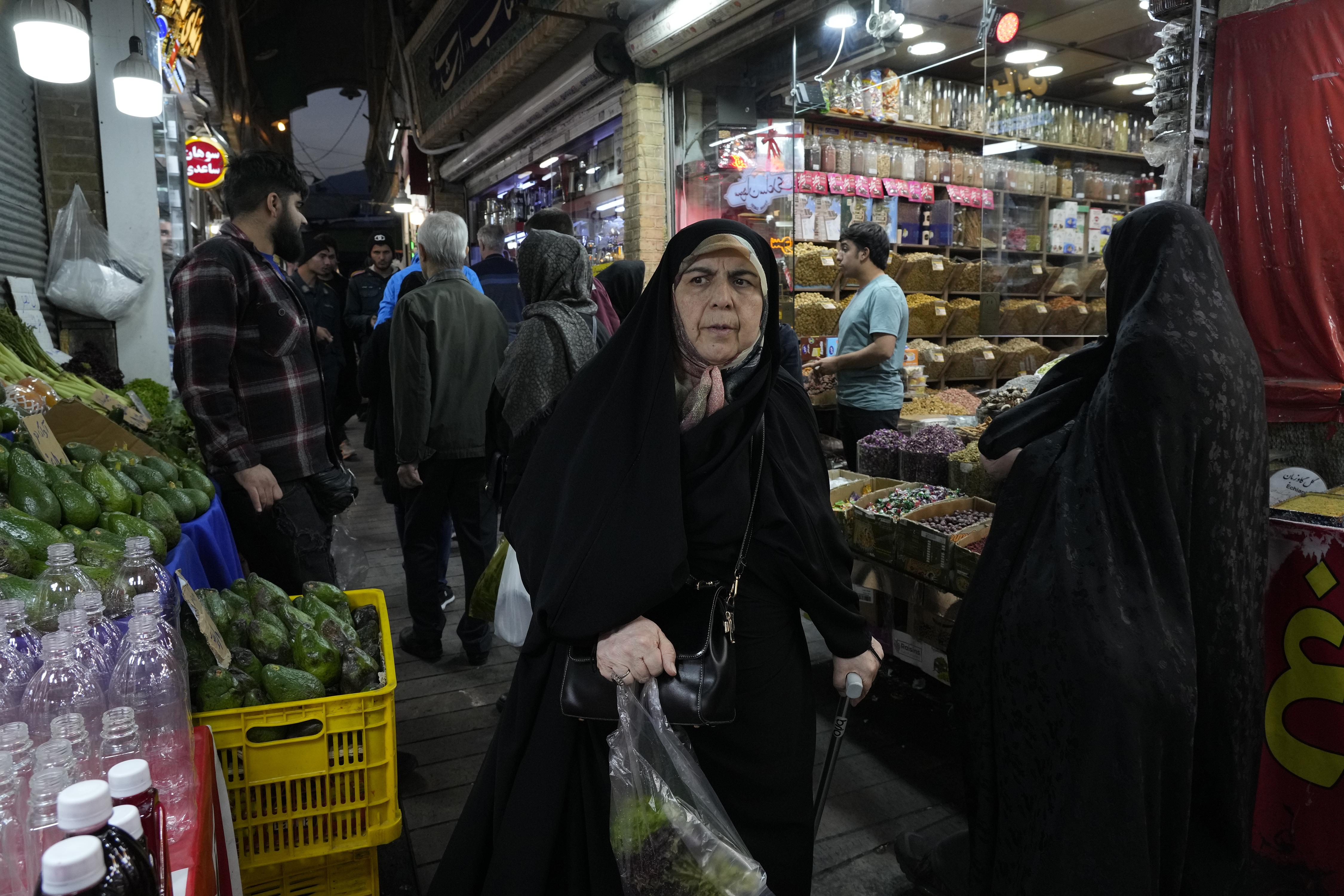 People shop at Tajrish traditional bazaar in northern Tehran, Iran, Saturday, Oct. 26, 2024. (AP Photo/Vahid Salemi)