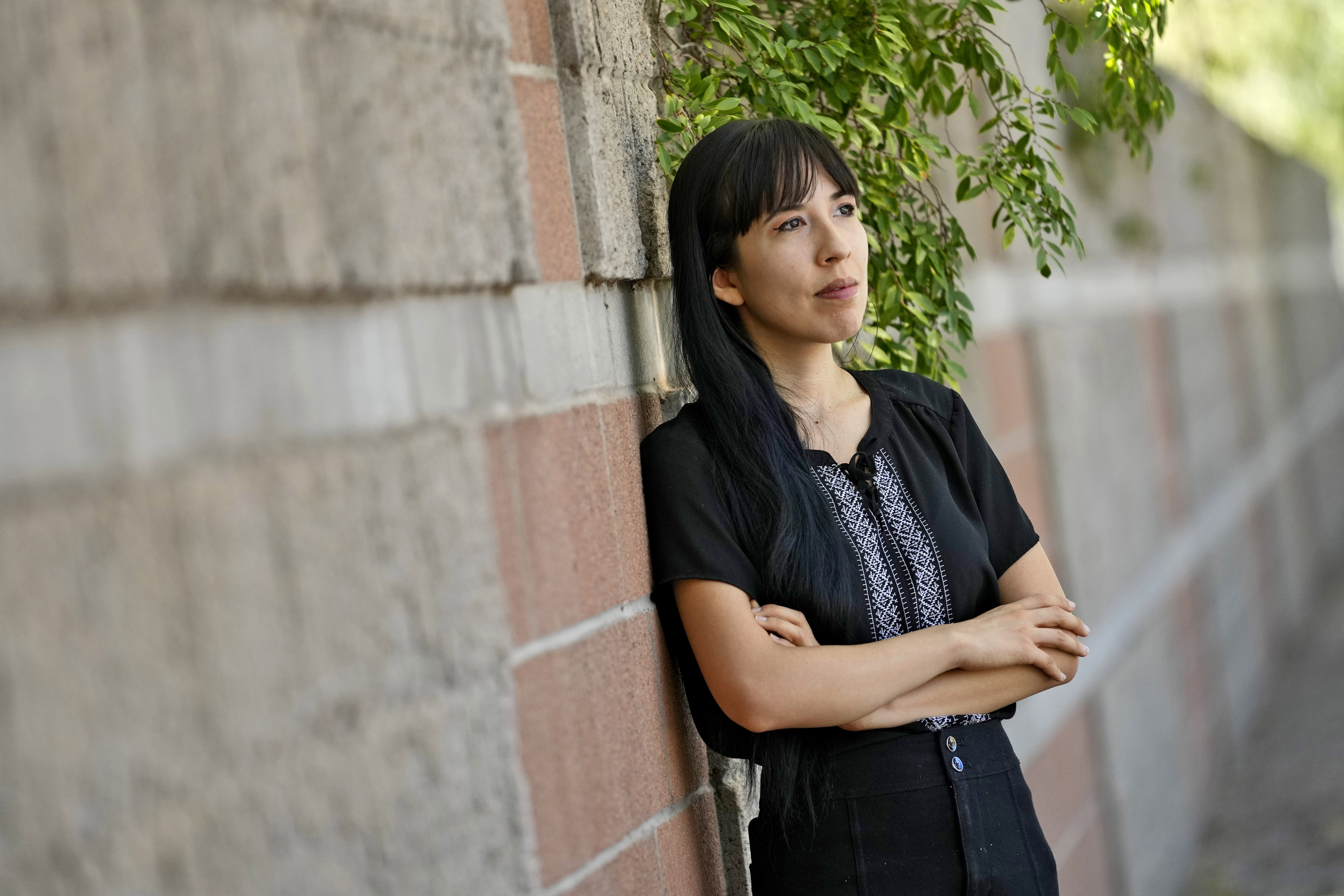 Jocelyn Ruiz, 26, pictured in Tempe, Ariz., Tuesday, Oct. 22, 2024, is a U.S. citizen who discovered a family secret that her mother could be deported at any time. (AP Photo/Matt York)