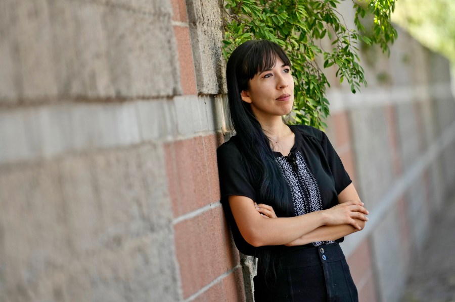 Jocelyn Ruiz, 26, pictured in Tempe, Ariz., Tuesday, Oct. 22, 2024, is a U.S. citizen who discovered a family secret that her mother could be deported at any time. (AP Photo/Matt York)