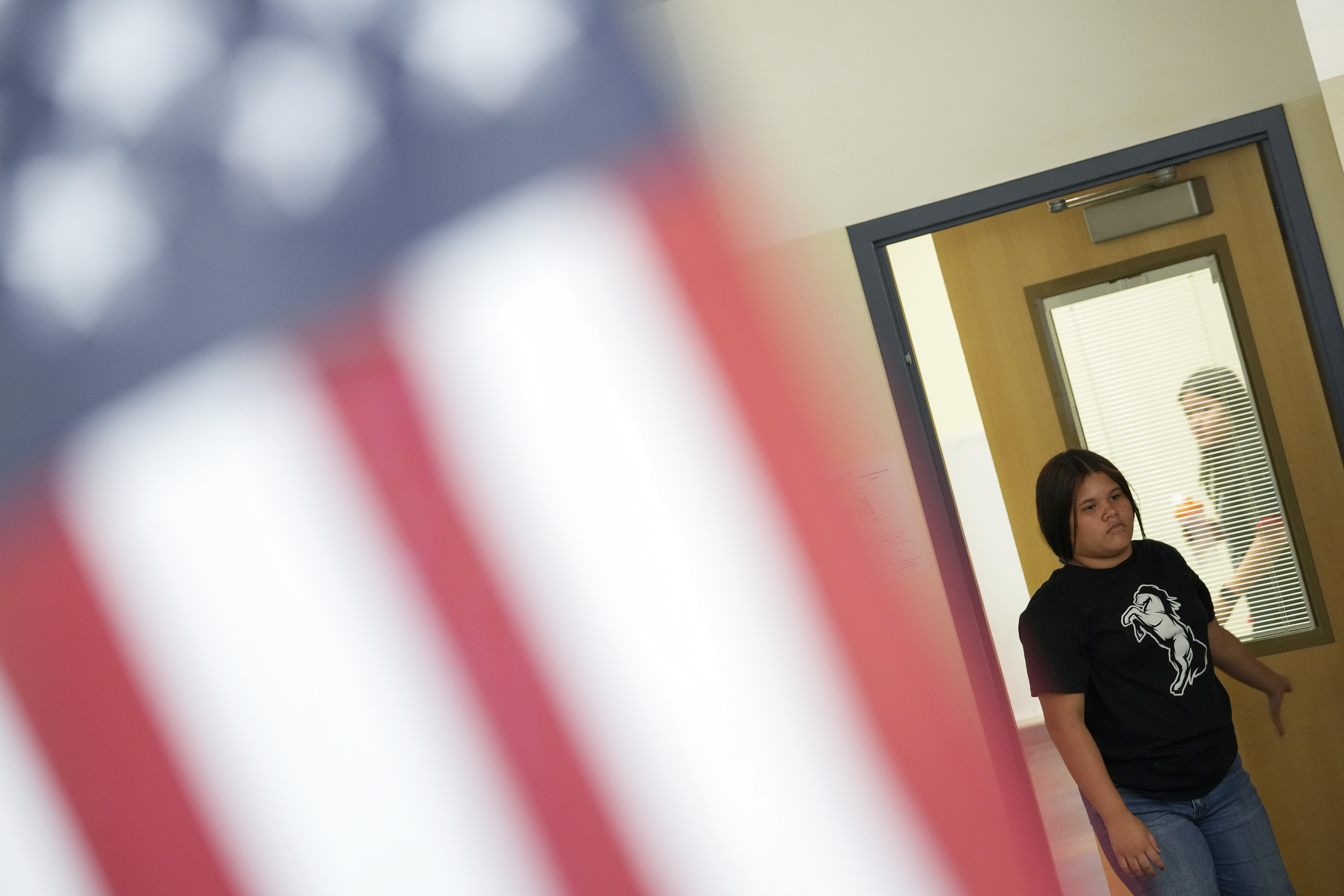 Alisson Ramírez walks into one of her classes at Aurora Hills Middle School, Wednesday, Aug. 28, 2024, in Aurora, Colo. (AP Photo/Godofredo A. Vásquez)