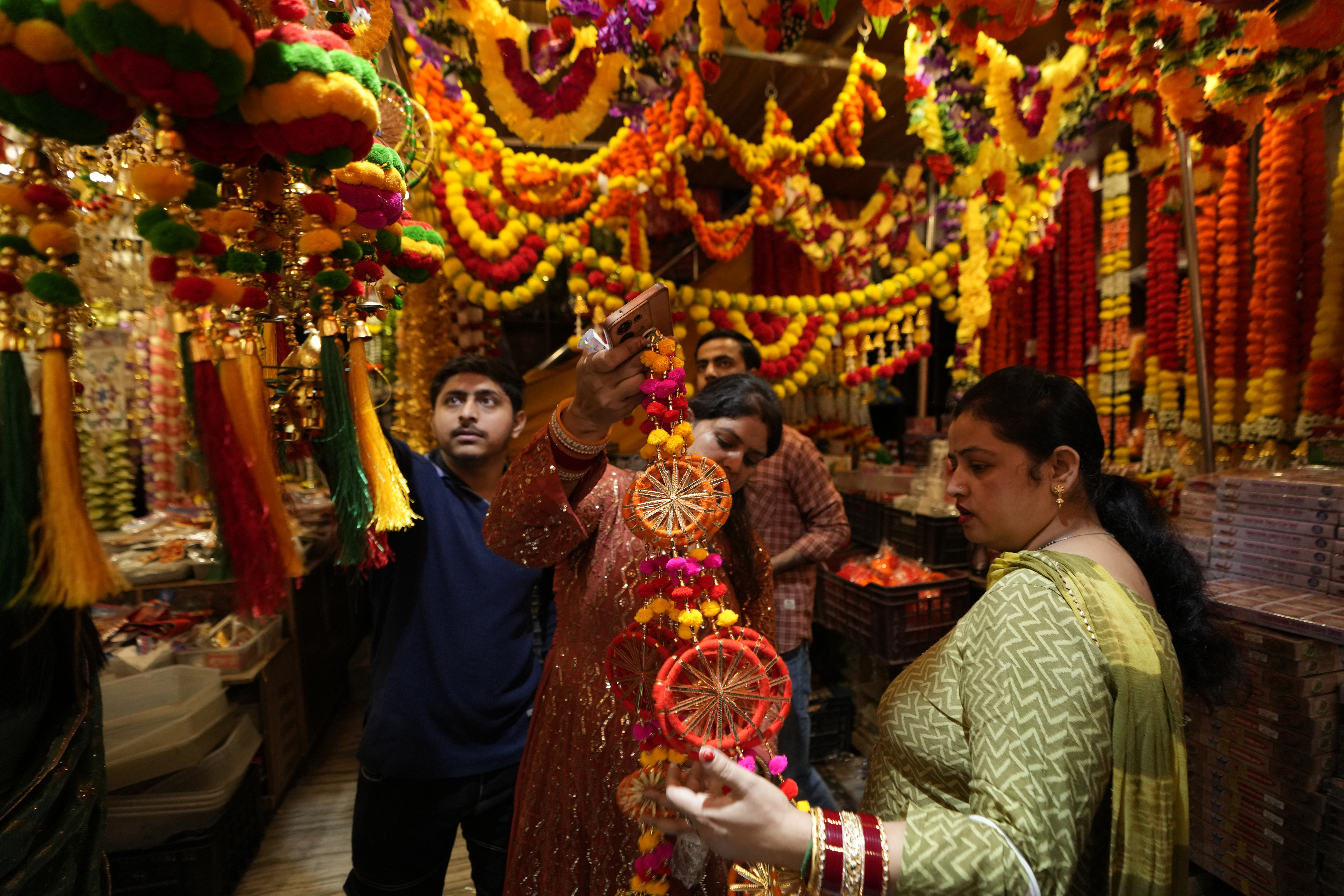 Women shop on the eve of Diwali, the Hindu festival of lights, in Jammu, India, Wednesday, Oct. 30, 2024.Diwali is one of Hinduism's most important festivals, dedicated to the worship of the goddess of wealth Lakshmi. (AP Photo/Channi Anand)