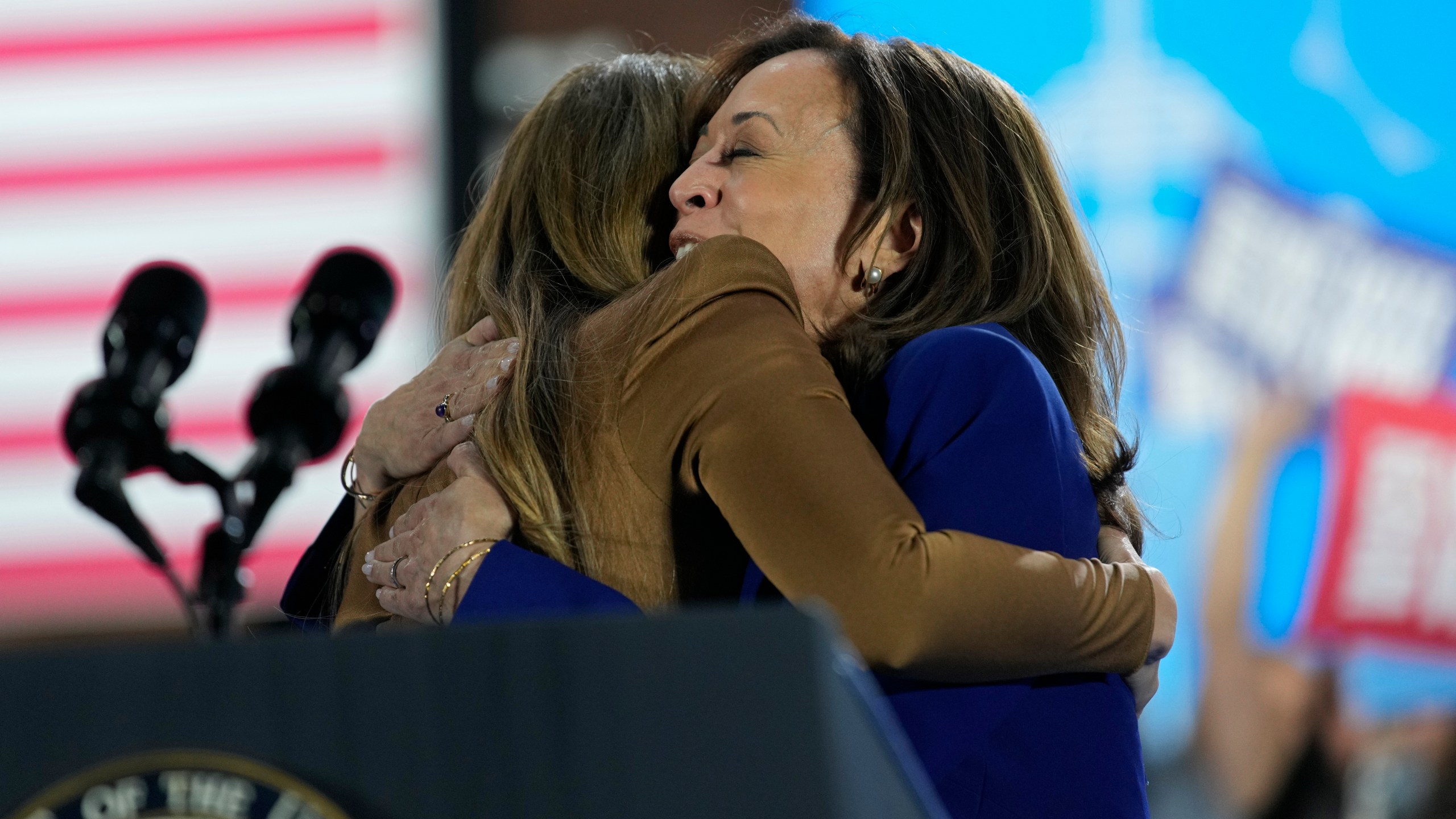 Jennifer Lopez, left, hugs Democratic presidential nominee Vice President Kamala Harris during a campaign rally Thursday, Oct. 31, 2024, in North Las Vegas, Nev. (AP Photo/John Locher)