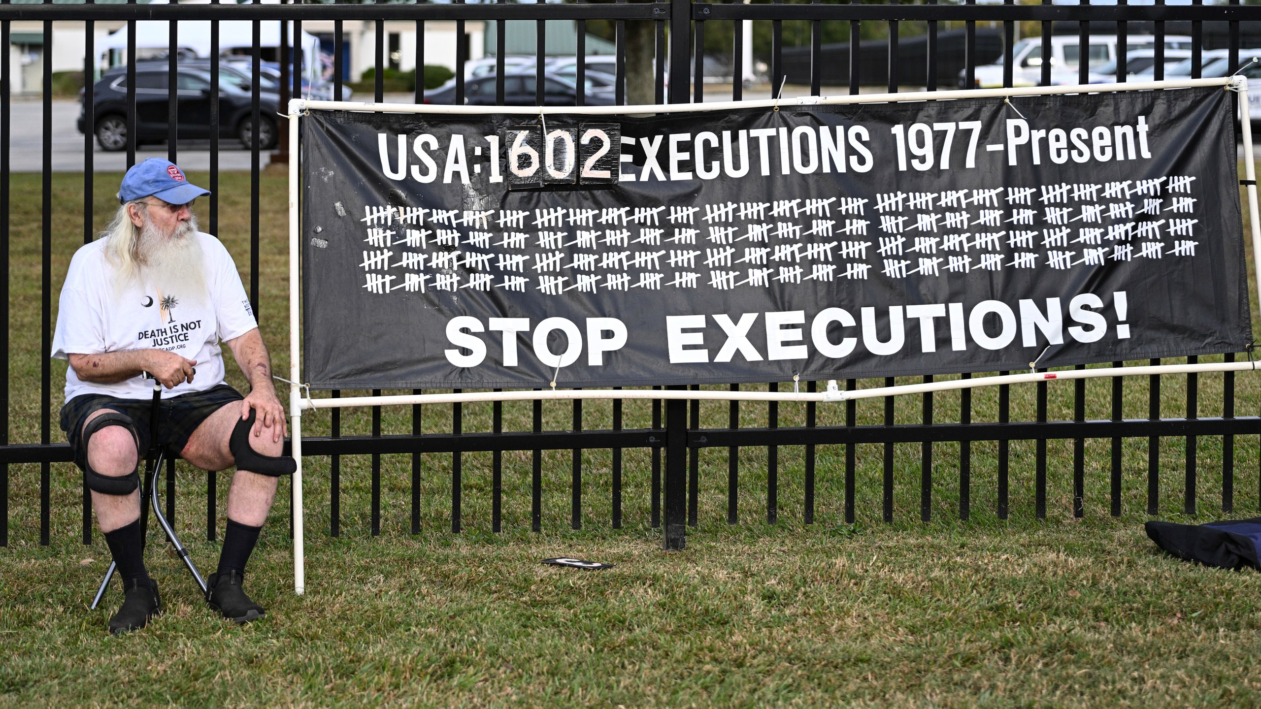 A protestor looks on prior to the scheduled execution of Richard Moore, Friday, Nov. 1, 2024, outside of Broad River Correctional Institution in Columbia , S.C. (AP Photo/Matt Kelley)