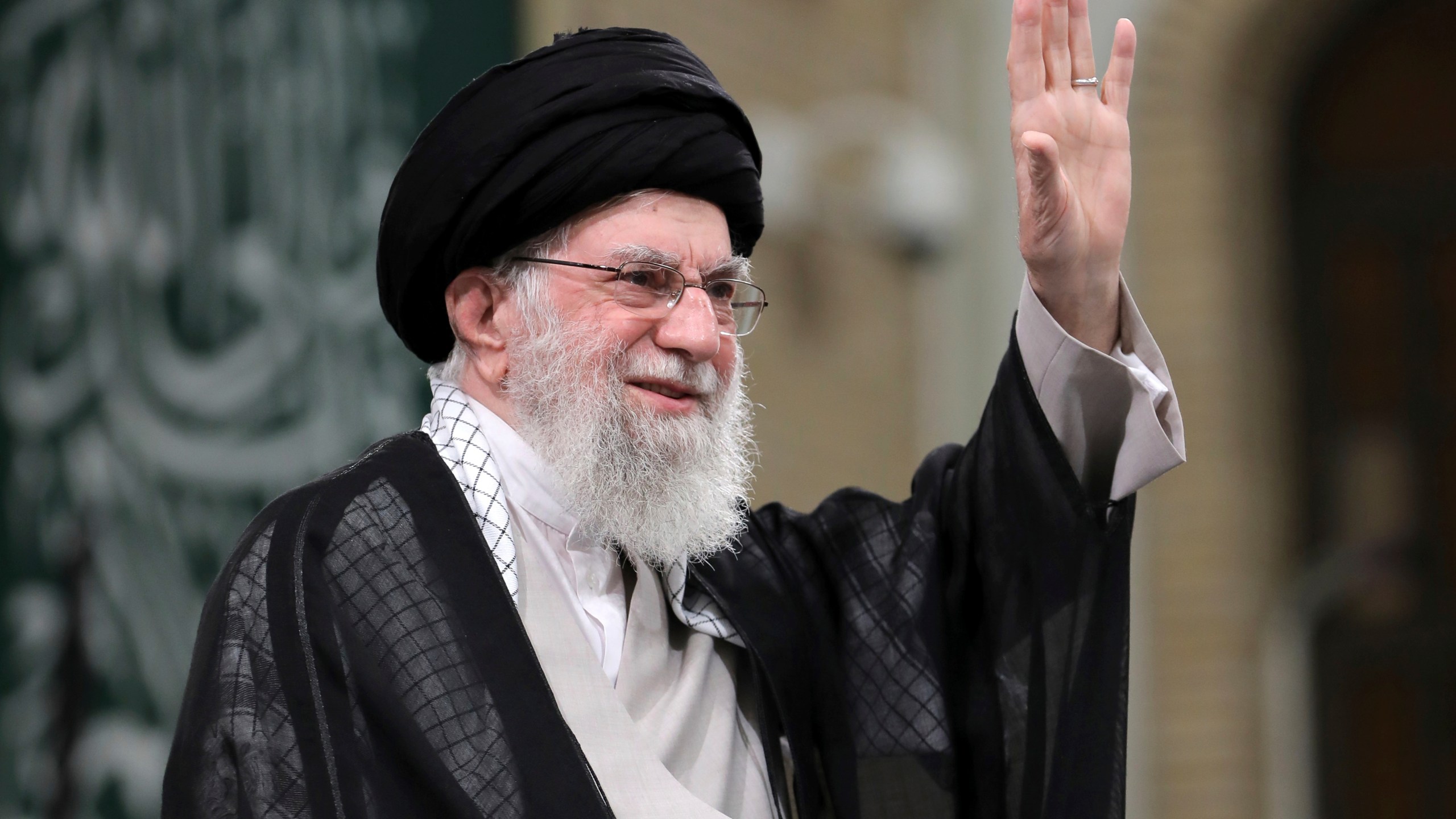 In this photo released by an official website of the office of the Iranian supreme leader, Supreme Leader Ayatollah Ali Khamenei waves to the crowd during a meeting with school and university students, in Tehran, Iran, Saturday, Nov. 2, 2024. (Office of the Iranian Supreme Leader via AP)