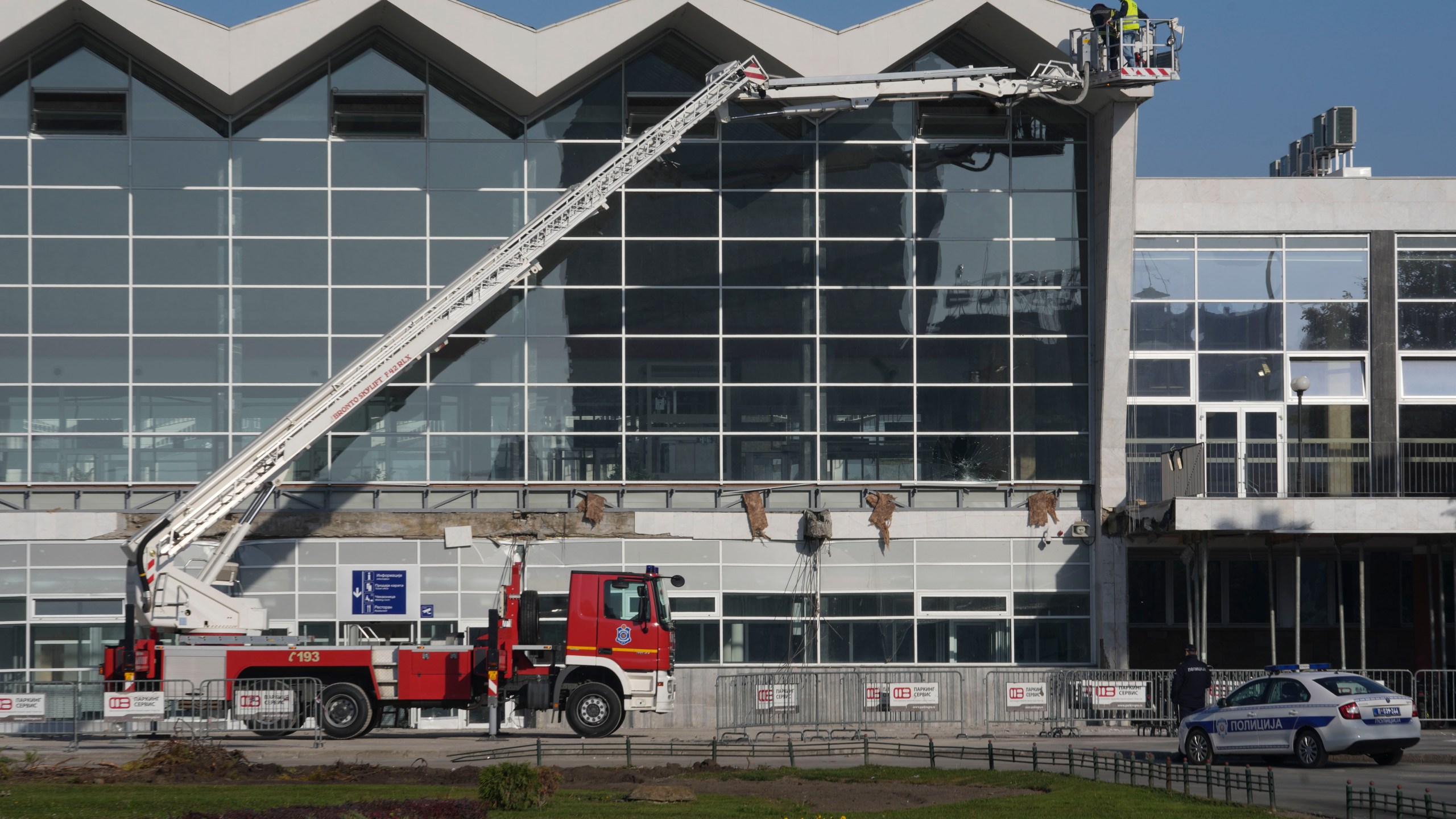 Workers inspect a train station after an outdoor roof collapsed o Friday, in Novi Sad, Serbia, Saturday, Nov. 2, 2024. (AP Photo/Darko Vojinovic)