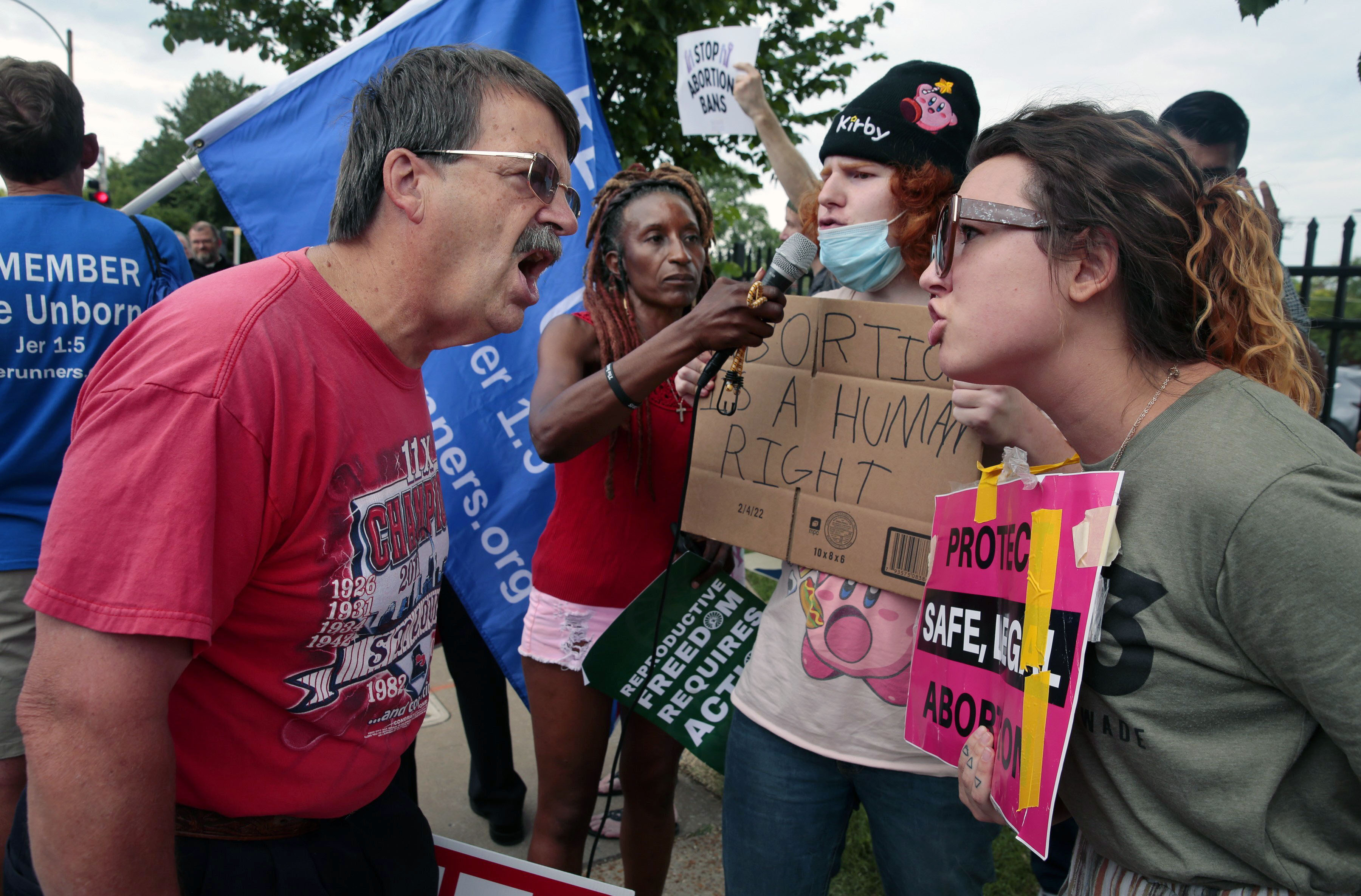 FILE - Steve Sallwasser, of Arnold, debates Brittany Nickens, of Maplewood, during competing rallies outside Planned Parenthood of Missouri, following the U.S. Supreme Court decision to overturn Roe v. Wade, June 24, 2022, in St. Louis. (Robert Cohen/St. Louis Post-Dispatch via AP, File)