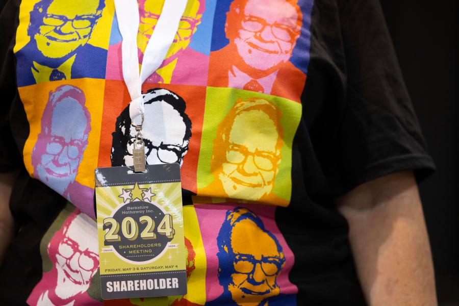 FILE - Shareholder Tina Schmidt of Cozad, Neb., wears a shirt with Warren Buffett's portrait in the style of an Andy Warhol painting at the Berkshire Hathaway annual meeting on May 4, 2024, in Omaha, Neb. (AP Photo/Rebecca S. Gratz, File)