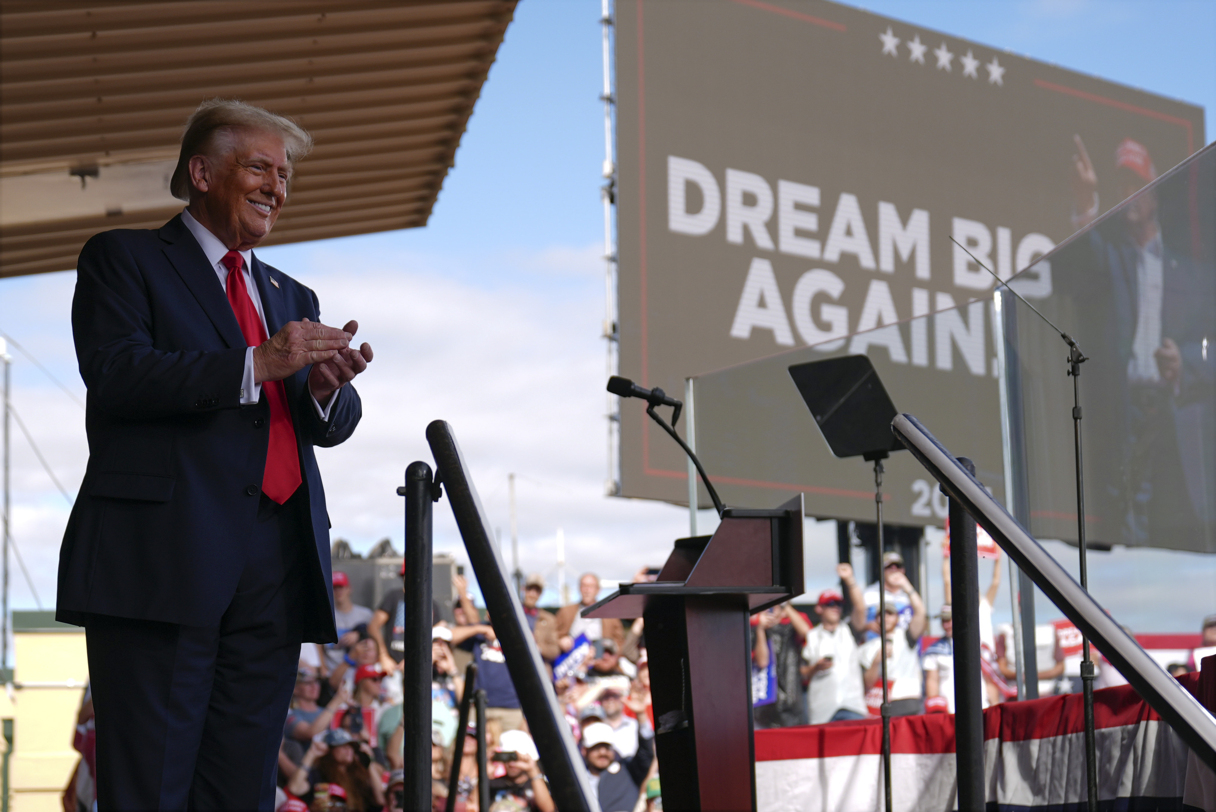 Republican presidential nominee former President Donald Trump smiles at a campaign rally at Gastonia Municipal Airport, Saturday, Nov. 2, 2024, in Gastonia, N.C. (AP Photo/Evan Vucci)