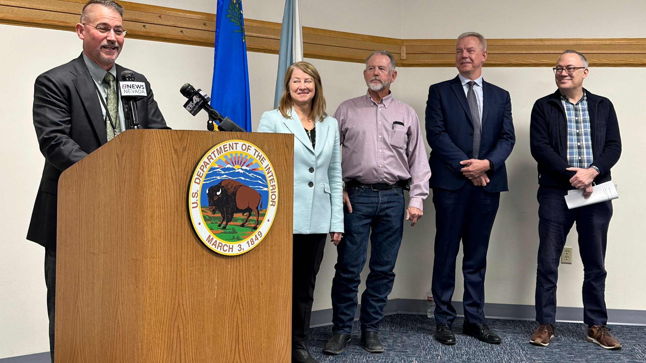 FILE - Jon Raby, left, Nevada state director for the U.S. Bureau of Land Management, speaks to reporters at BLM state headquarters in Reno, Nev., Thursday, Oct. 24, 2024, during a news conference announcing approval of a federal permit for Ioneer Ltd.'s lithium-boron mine now scheduled to begin construction next year near the California line about halfway between Reno and Las Vegas. Others who participated include, from left, Acting Deputy U.S. Interior Secretary Laura Daniel-Davis, Esmeralda County Commissioner Ralph Keys, Ioneer CEO Bernard Rowe and Steve Feldgus, principal deputy assistant U.S. interior secretary for land and minerals management. (AP Photo/Scott Sonner, File)