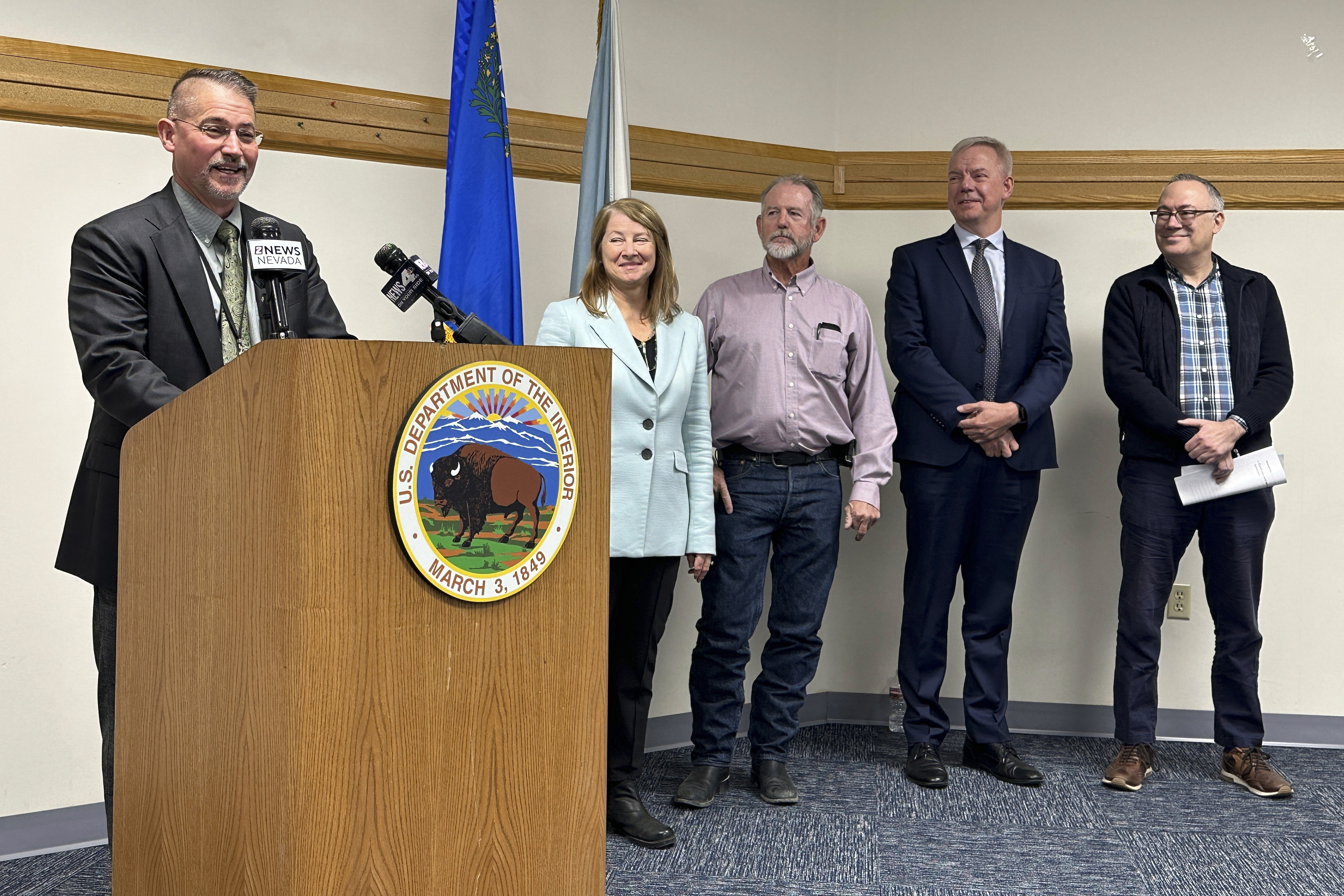 FILE - Jon Raby, left, Nevada state director for the U.S. Bureau of Land Management, speaks to reporters at BLM state headquarters in Reno, Nev., Thursday, Oct. 24, 2024, during a news conference announcing approval of a federal permit for Ioneer Ltd.'s lithium-boron mine now scheduled to begin construction next year near the California line about halfway between Reno and Las Vegas. Others who participated include, from left, Acting Deputy U.S. Interior Secretary Laura Daniel-Davis, Esmeralda County Commissioner Ralph Keys, Ioneer CEO Bernard Rowe and Steve Feldgus, principal deputy assistant U.S. interior secretary for land and minerals management. (AP Photo/Scott Sonner, File)