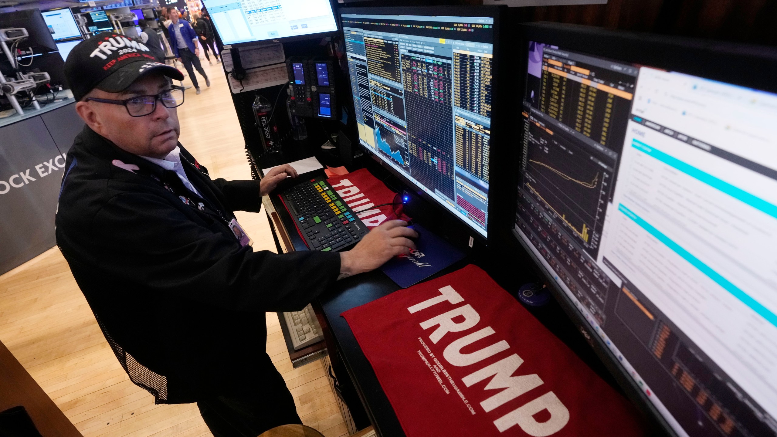 Trader Jonathan Mueller works on the floor of the New York Stock Exchange, Monday, Nov. 4, 2024. (AP Photo/Richard Drew)