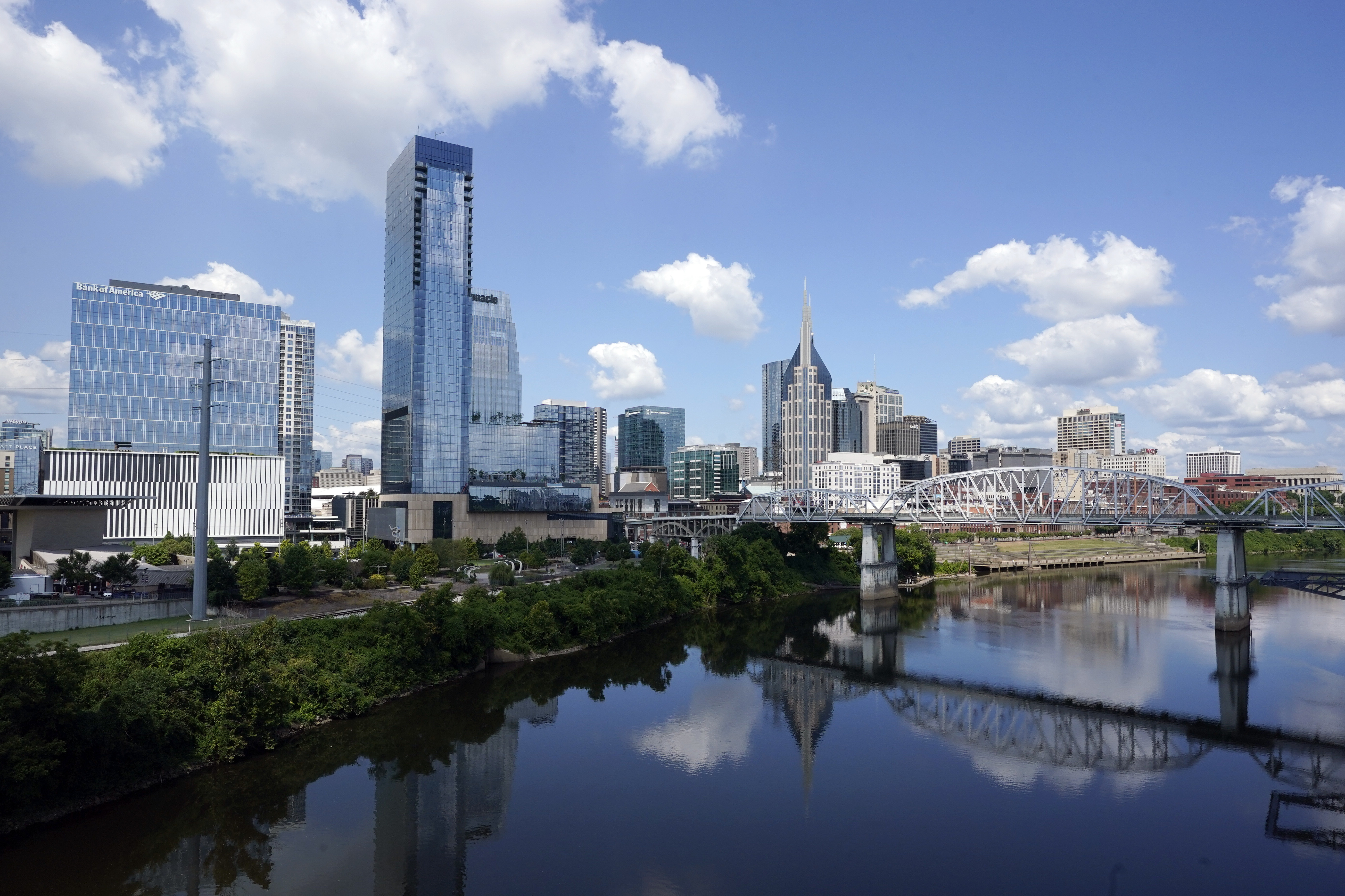 FILE - The Nashville, Tenn., skyline is reflected in the Cumberland River July 11, 2022. (AP Photo/Mark Humphrey, File)