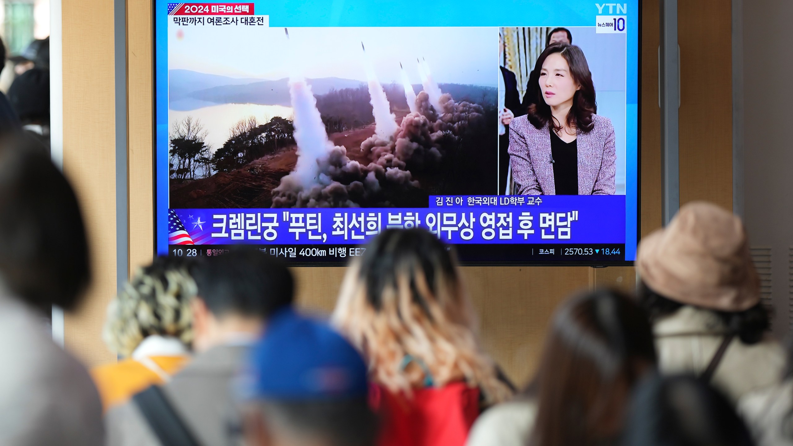 A TV screen shows a report of North Korea's multiple short-range ballistic missiles with file footage during a news program at the Seoul Railway Station in Seoul, South Korea, Tuesday, Nov. 5, 2024. (AP Photo/Lee Jin-man)