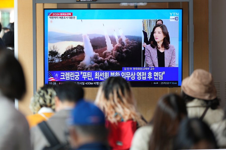 A TV screen shows a report of North Korea's multiple short-range ballistic missiles with file footage during a news program at the Seoul Railway Station in Seoul, South Korea, Tuesday, Nov. 5, 2024. (AP Photo/Lee Jin-man)