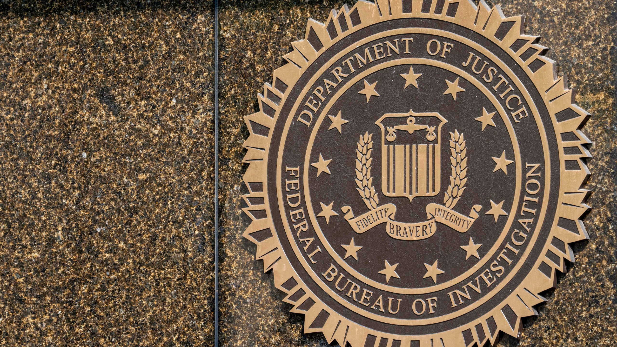 FILE - The seal on the J. Edgar Hoover FBI Building is seen June 9, 2023, in Washington. (AP Photo/Alex Brandon, File)