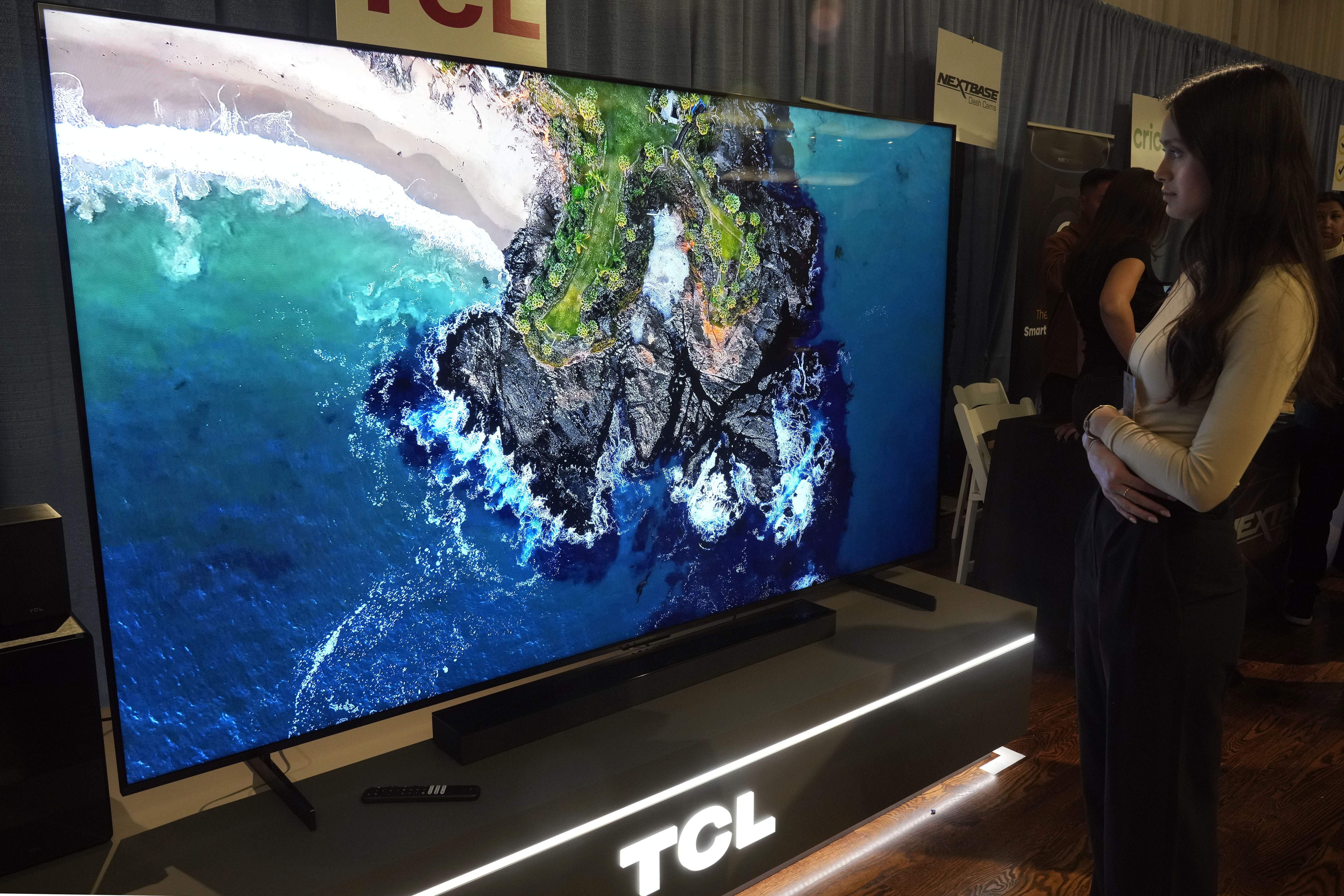 A 98-inch TCL QM-8 Q-Class Mini-LED QLED 4K HDR Smart TV is displayed at the Pepcom Holiday Spectacular event, in New York, Wednesday, Oct. 30, 2024. (AP Photo/Richard Drew)