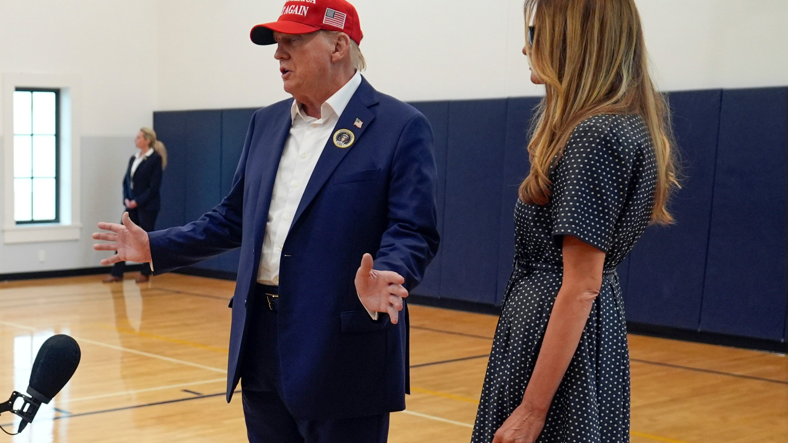 Republican presidential nominee former President Donald Trump speaks as former first lady Melania Trump listens after they voted on Election Day at the Morton and Barbara Mandel Recreation Center, Tuesday, Nov. 5, 2024, in Palm Beach, Fla. (AP Photo/Evan Vucci)