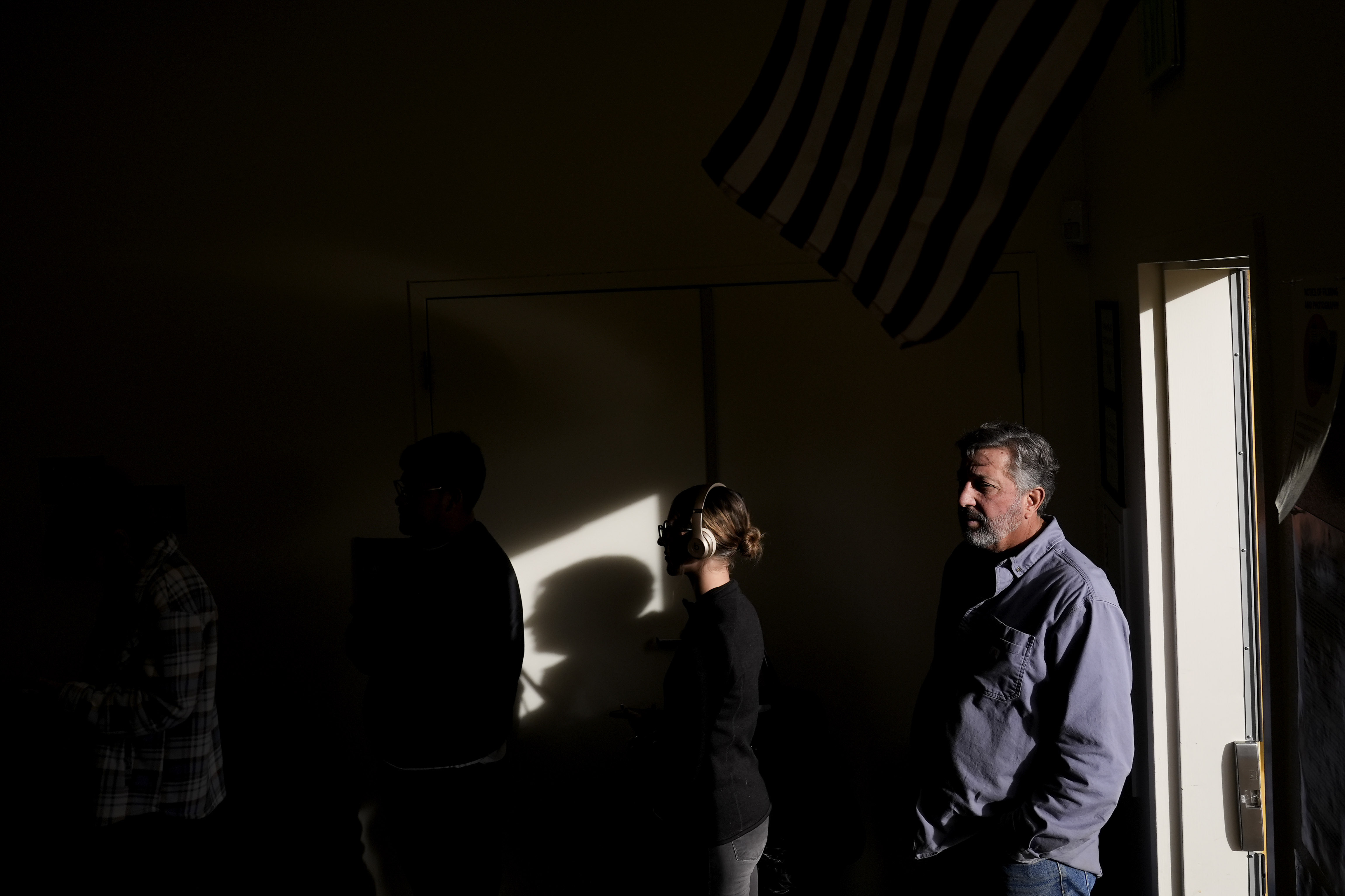 People wait in line to vote at South Valleys Library, Tuesday, Nov. 5, 2024, in Reno, Nev. (AP Photo/Godofredo A. Vasquez)