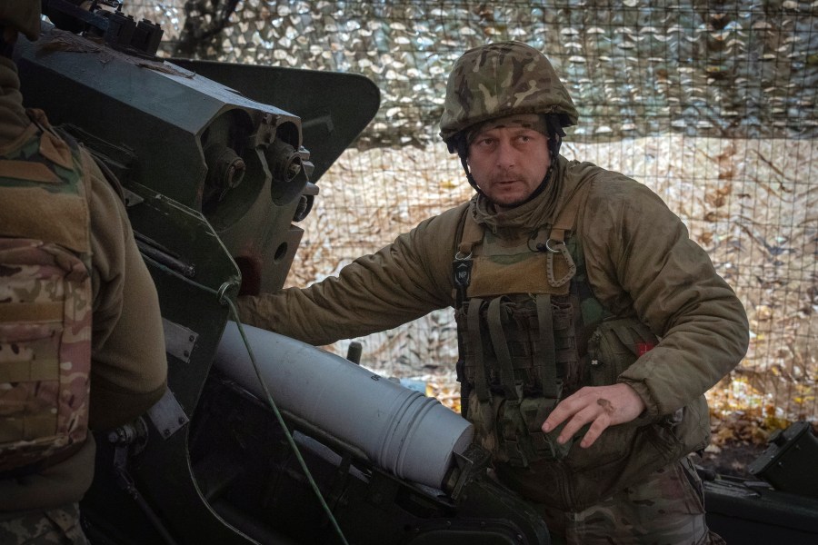 A serviceman of the 13th Brigade of the National Guard of Ukraine prepares to fire a Giatsint-B gun towards Russian positions near Kharkiv, Ukraine, Wednesday, Nov. 6, 2024. (AP Photo/Efrem Lukatsky)