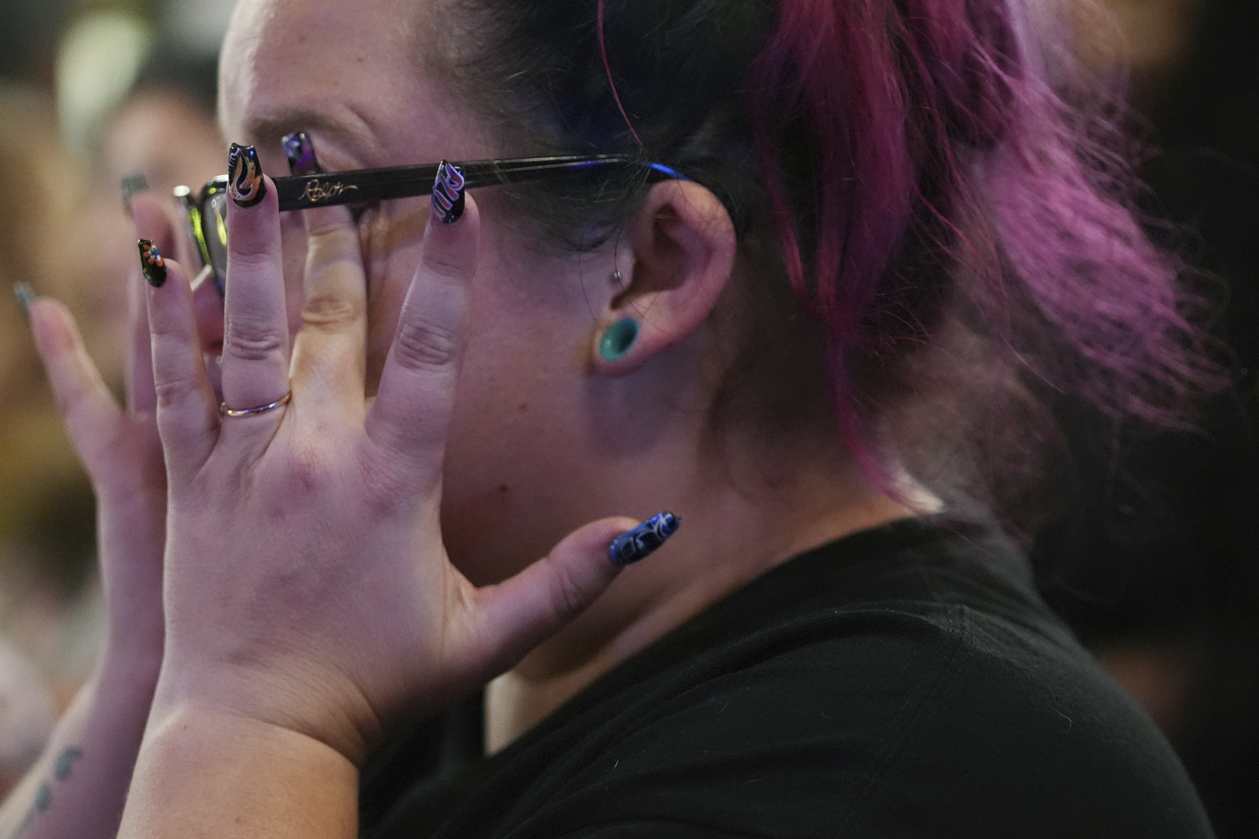 Emmie Reed, center, co-founder of Bans Off Our Bodies Florida collective, wipes away tears after Florida's Amendment 4, which would have enshrined abortion rights in the state, fell short of the 60% vote threshold required to pass, during a watch party for the Yes On 4 campaign, on Election Day, Tuesday, Nov. 5, 2024, in St. Petersburg, Fla. (AP Photo/Rebecca Blackwell)