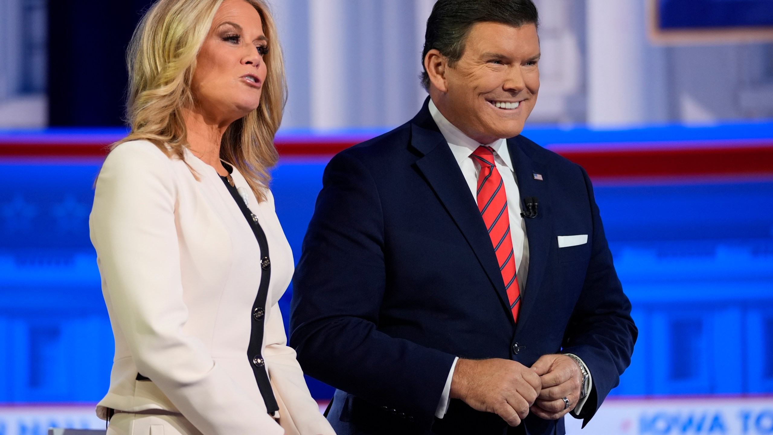 FILE - Moderators Martha MacCallum and Bret Baier appear before Republican presidential candidate former President Donald Trump speaks during a Fox News Channel town hall in Des Moines, Iowa, Jan. 10, 2024. (AP Photo/Carolyn Kaster, File)