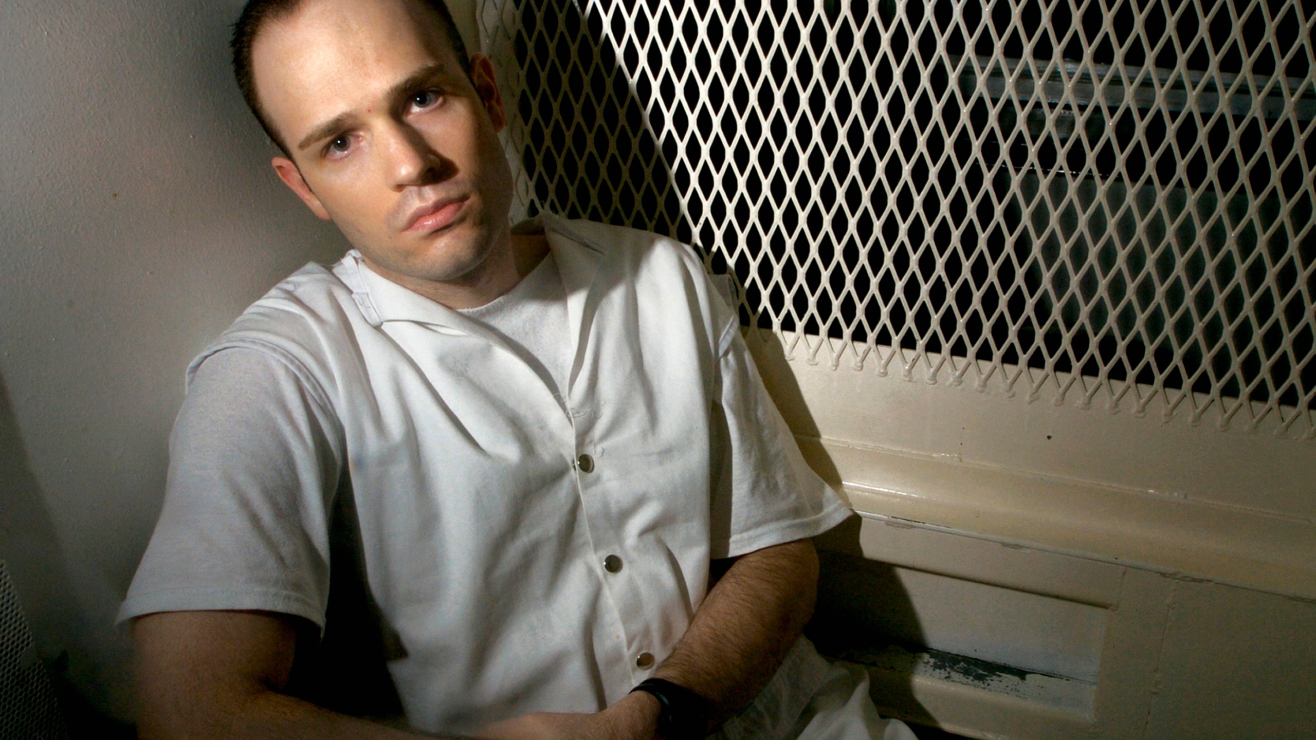 FILE - Death row inmate Randy Halprin, then 26, sits in a visitation cell at the Polunsky Unit in Livingston, Texas, Dec. 3, 2003. (AP Photo/Brett Coomer, File)