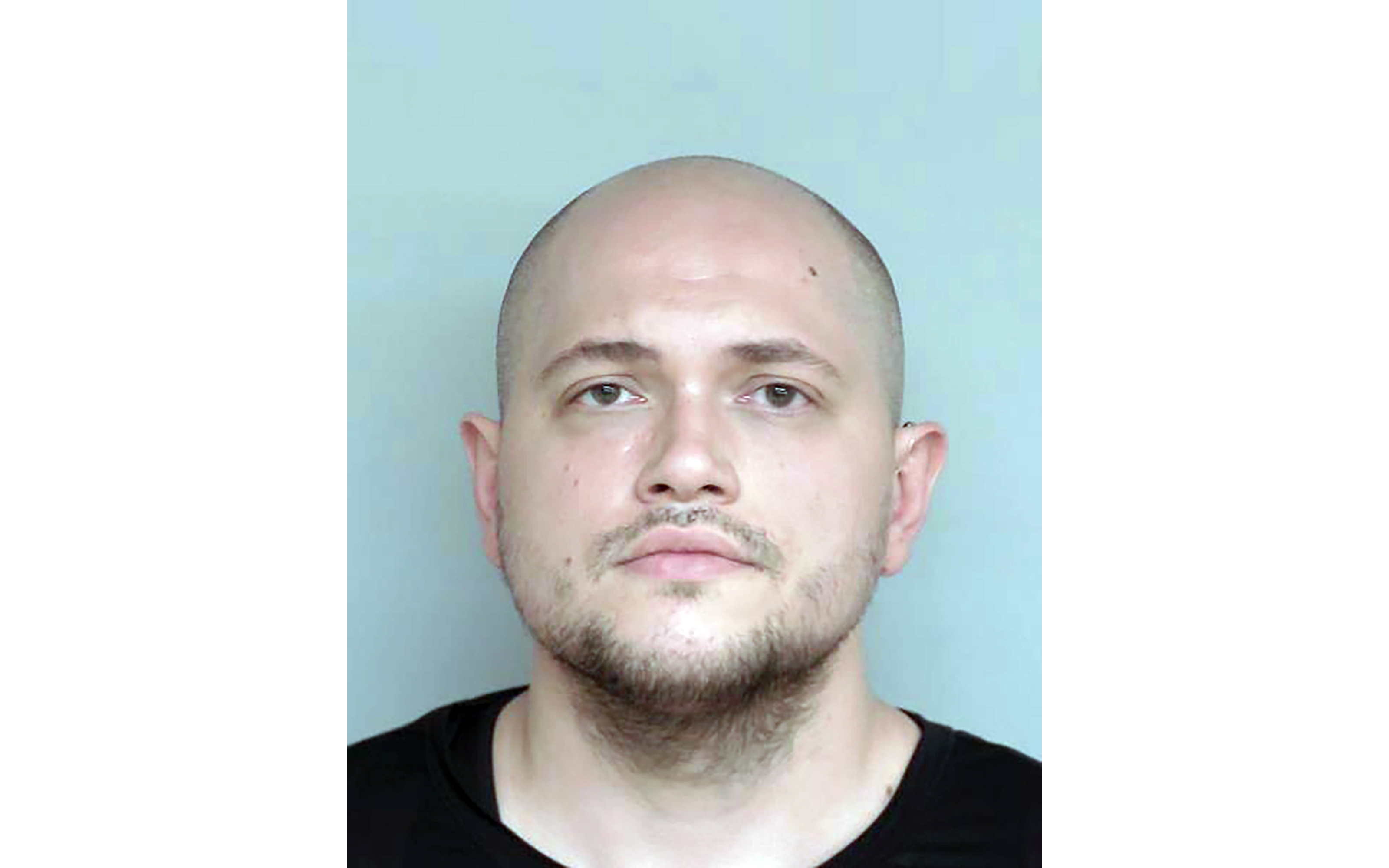 FILE - This undated booking photo provided by the Winona County, Minn., Detention Center shows Adam Fravel. (Winona County Detention Center via AP, File)