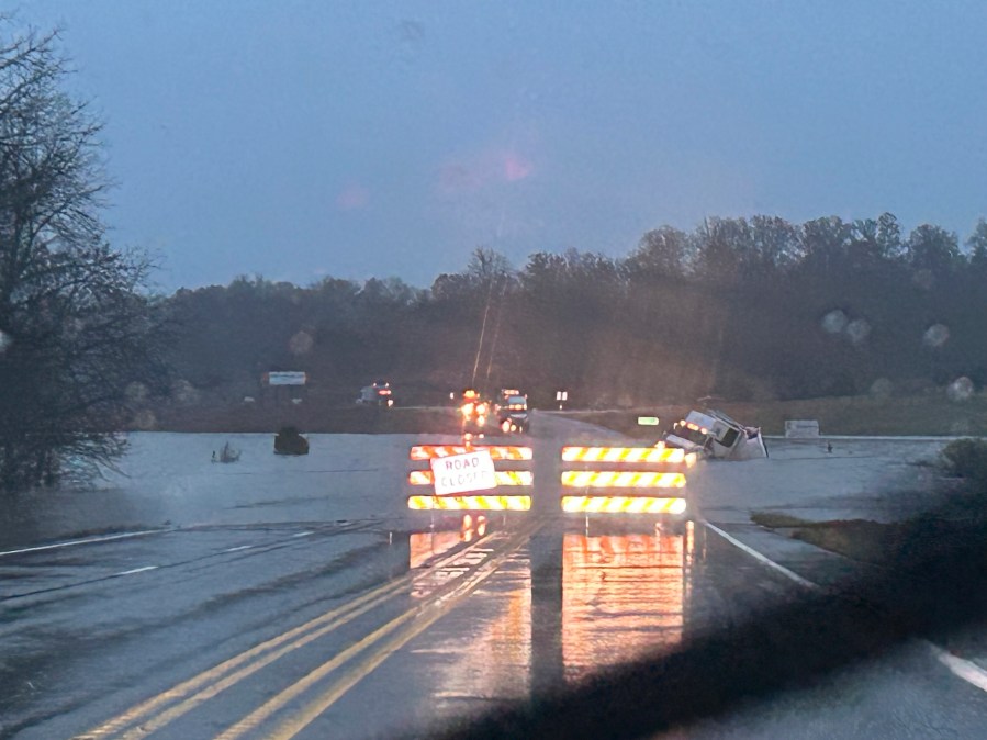 In a photo released by the Missouri State Highway Patrol, a tractor trailer sits submerged in flood water on US 63 just north of Cabool, Mo., Tuesday, Nov. 5, 2024. (Missouri State Highway Patrol via AP)