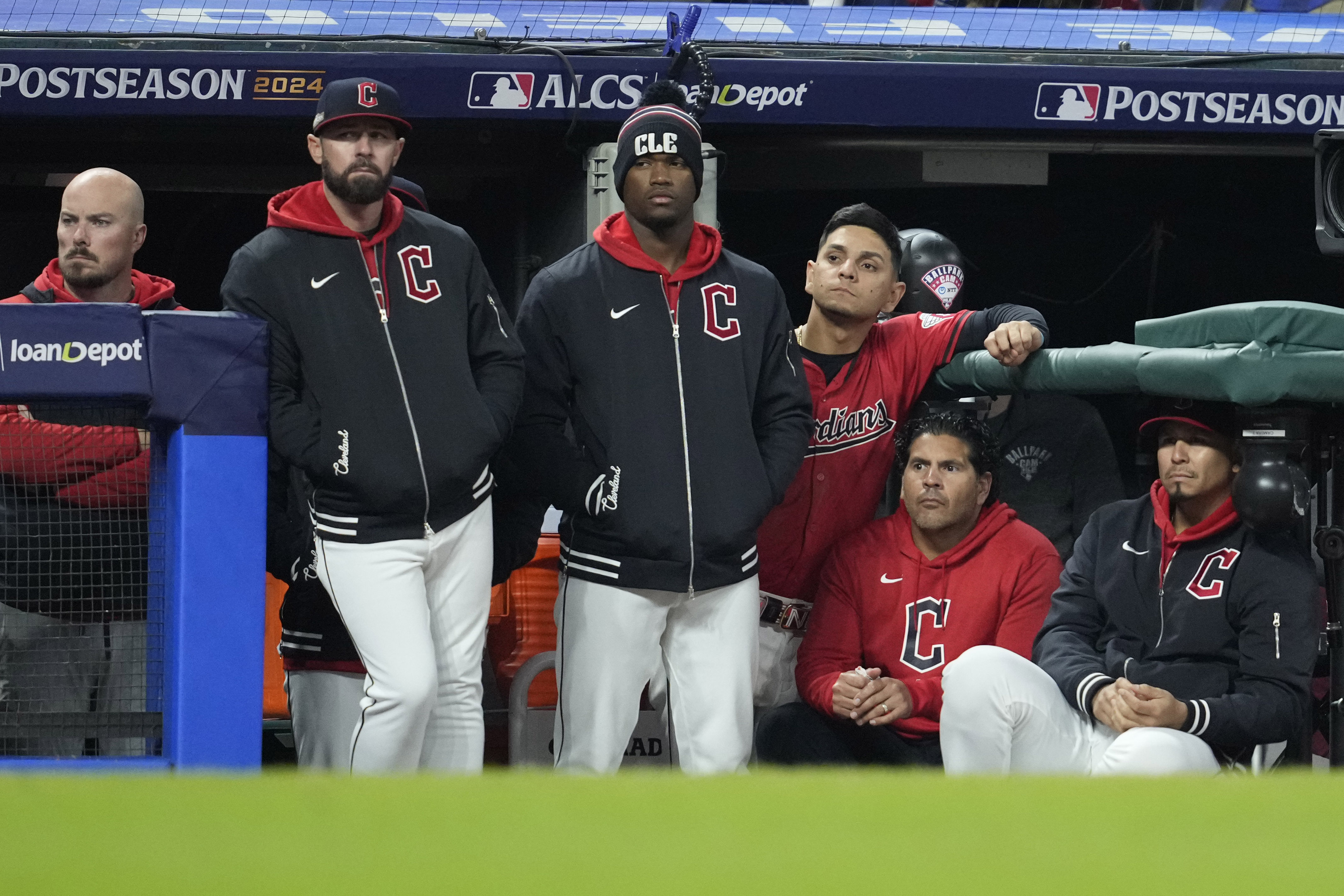 Cleveland Guardians players watch from the dugout during the 10th inning against the New York Yankees in Game 5 of the baseball AL Championship Series Saturday, Oct. 19, 2024, in Cleveland. The Yankees won 5-2. (AP Photo/Godofredo A. Vásquez)