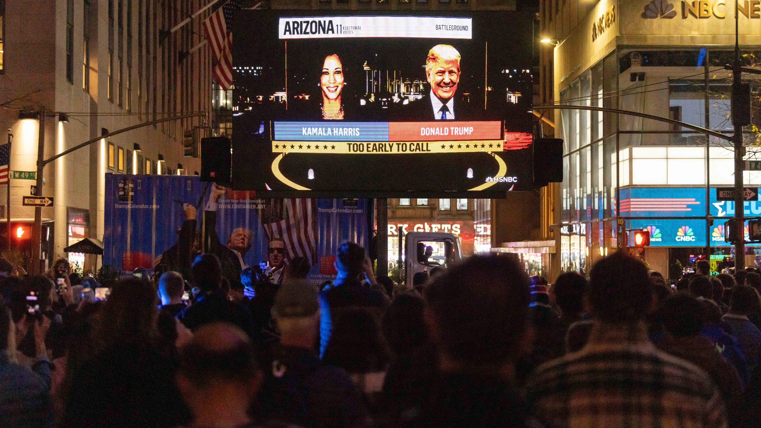 People watch an NBC News livestream showing poll results at Rockefeller Center in New York on Election Day, Tuesday, Nov. 5, 2024. (AP Photo/Yuki Iwamura)