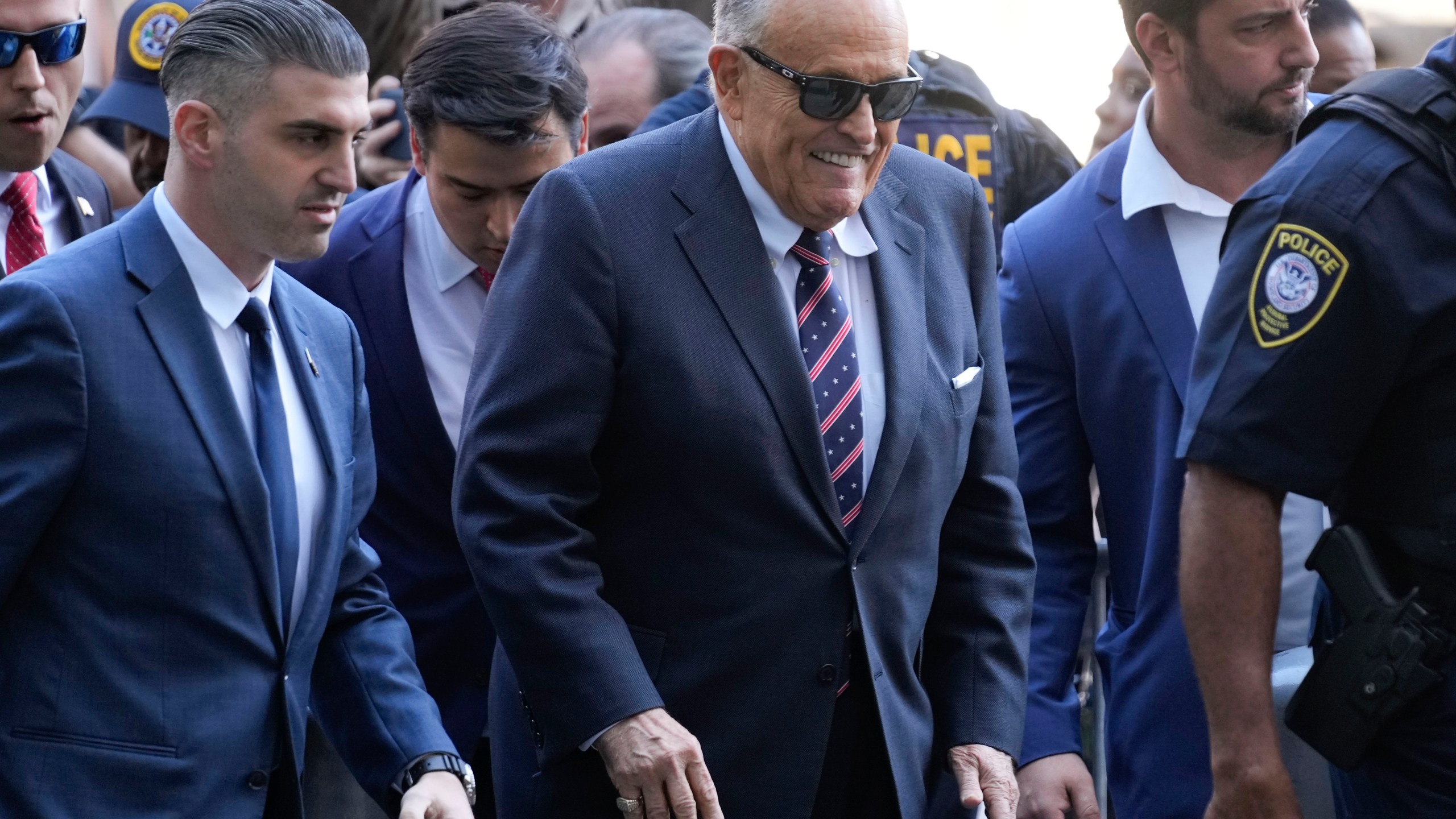 Rudy Giuliani, center, arrives to federal court in New York, Thursday, Nov. 7, 2024. (AP Photo/Seth Wenig)