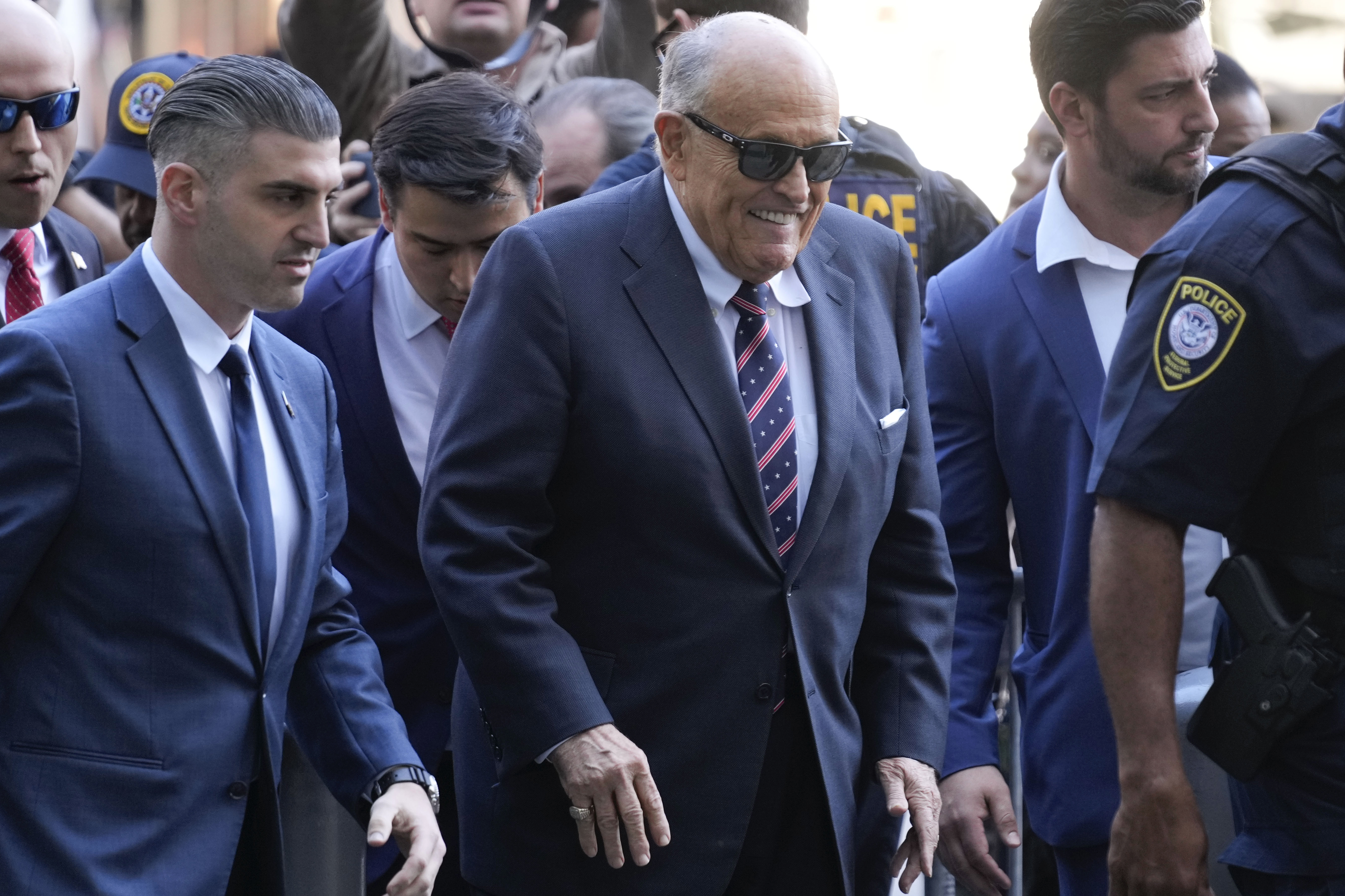 Rudy Giuliani, center, arrives to federal court in New York, Thursday, Nov. 7, 2024. (AP Photo/Seth Wenig)