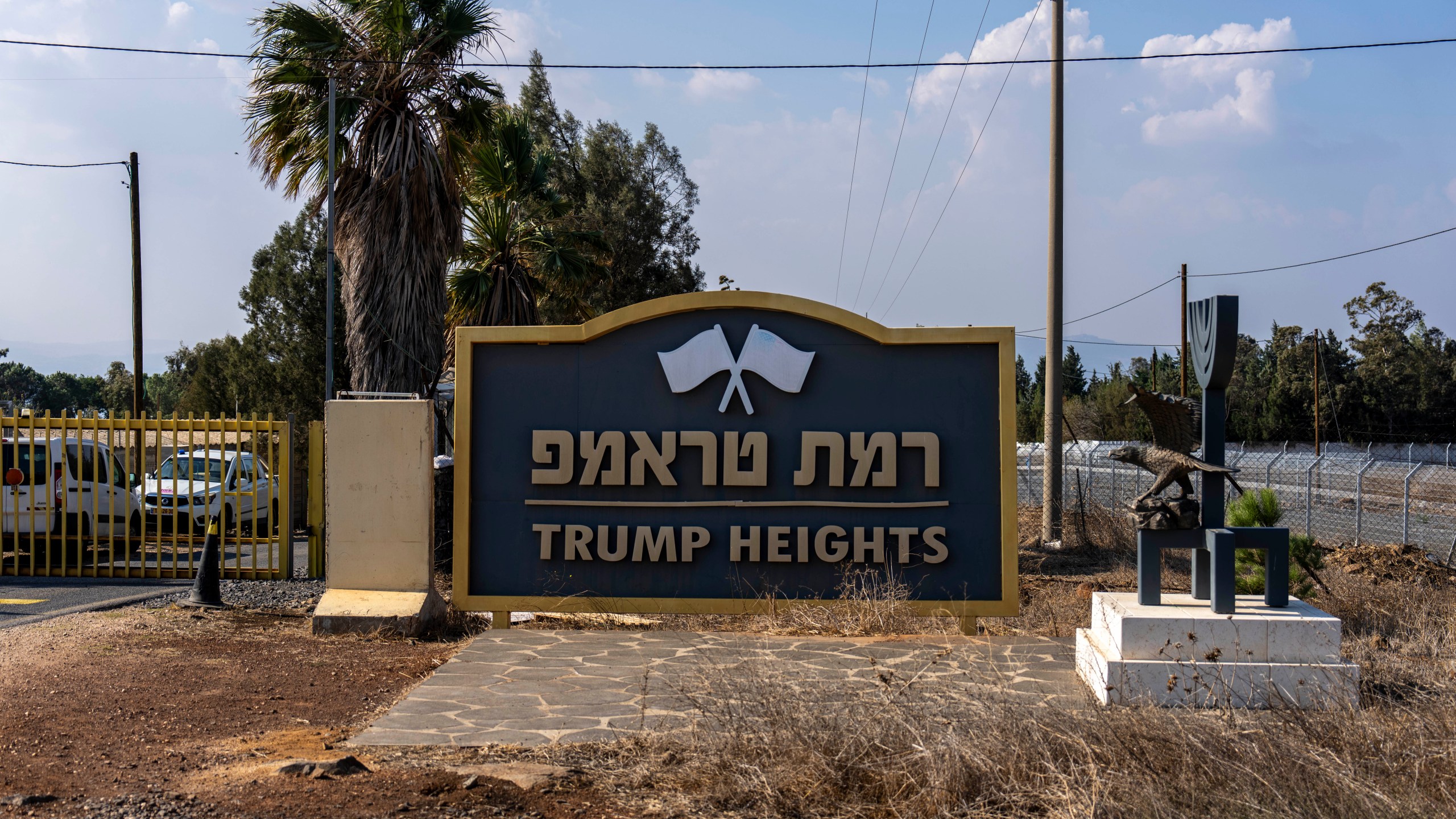 The entrance to the tiny settlement of "Trump Heights" in the Israeli-controlled Golan Heights, where the Israeli residents are welcoming the election of their namesake. They hope Donald Trump's return to the U.S. presidency will breathe new life into the community. Thursday, Nov. 7, 2024. (AP Photo/Ariel Schalit)