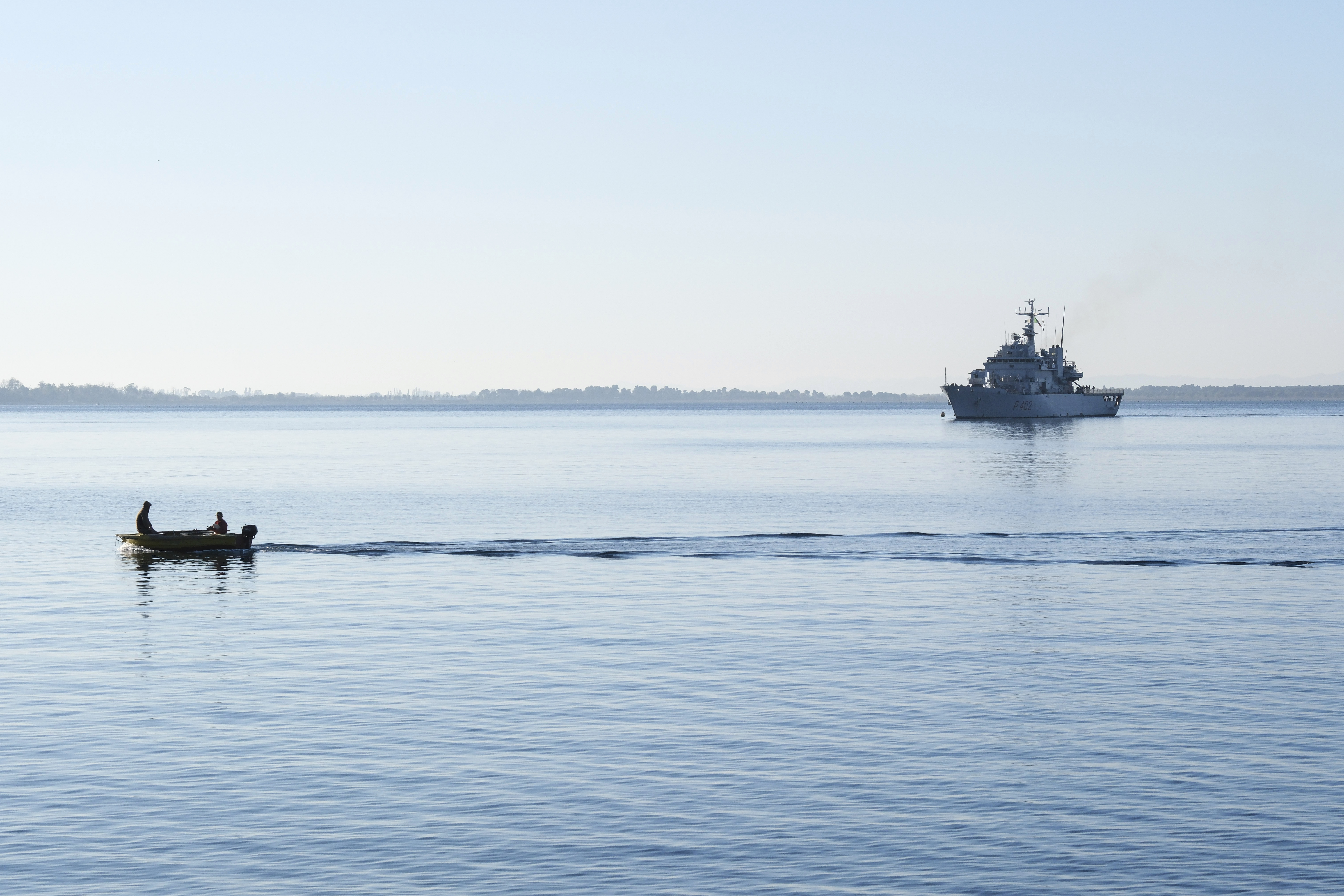 The Italian navy ship Libra approaches the port of Shengjin, northwestern Albania, Friday, Nov. 8, 2024, with the second group of eight migrants intercepted in international waters to be processed there in a reception facility despite the failure with the first group in October.(AP Photo/Vlasov Sulaj)