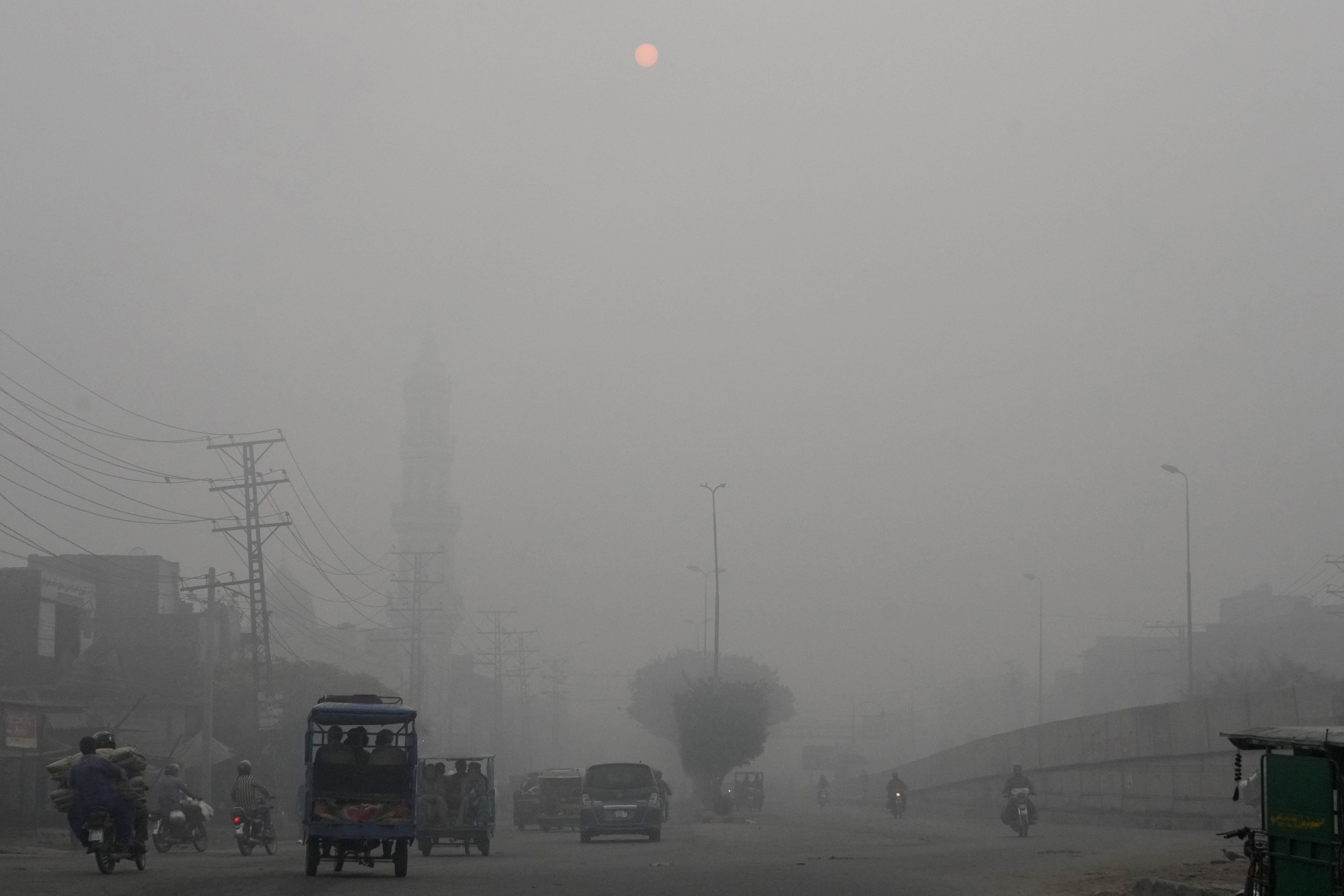 Smog envelops an area in the morning in Lahore, Pakistan, Friday, Nov. 8, 2024. (AP Photo/K.M. Chaudary)