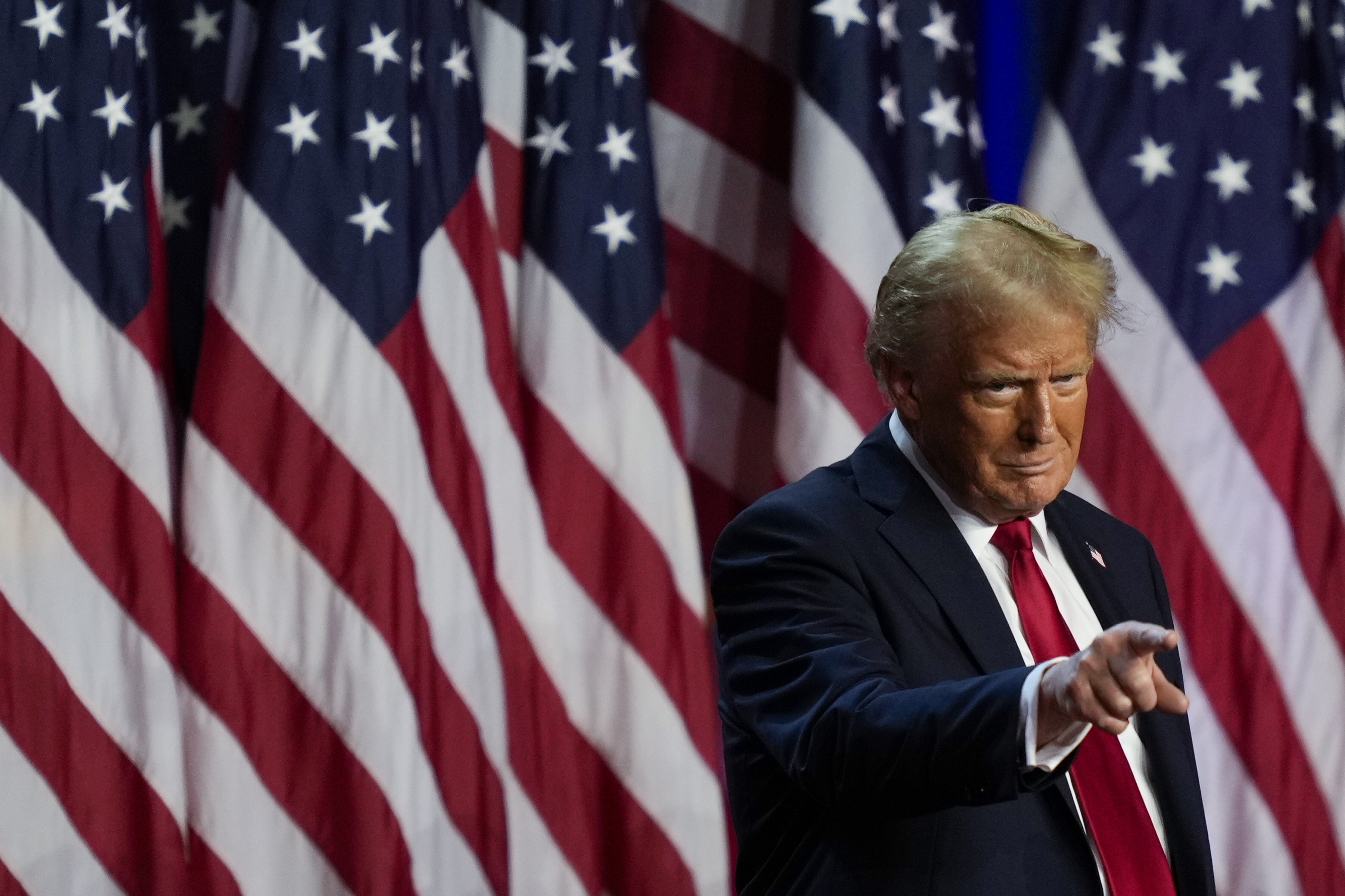 Republican presidential nominee former President Donald Trump points to the crowd at an election night watch party, Wednesday, Nov. 6, 2024, in West Palm Beach, Fla. (AP Photo/Julia Demaree Nikhinson)