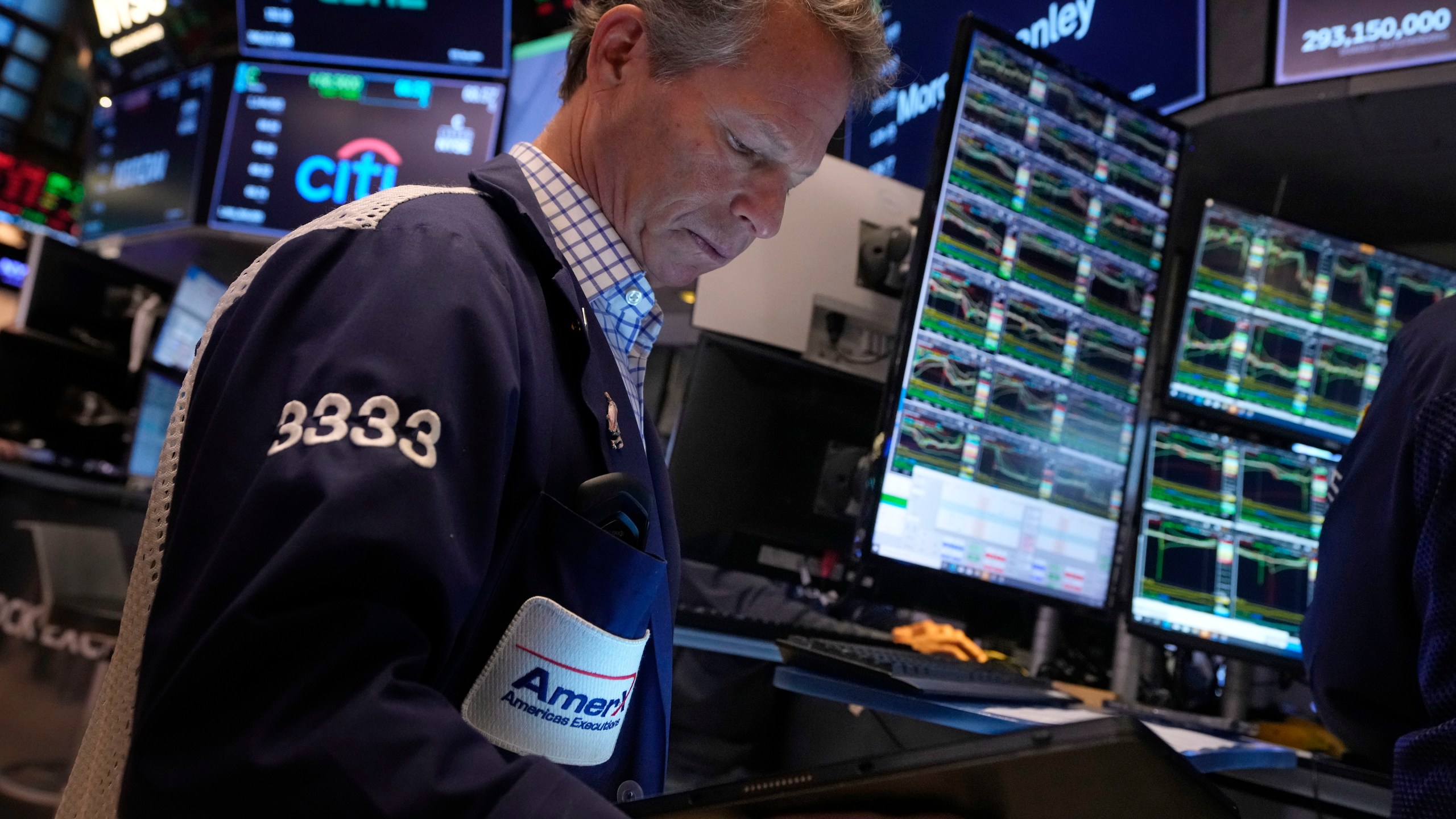 Trader Robert Charmak works on the floor of the New York Stock Exchange, Friday, Nov. 8, 2024. (AP Photo/Richard Drew)