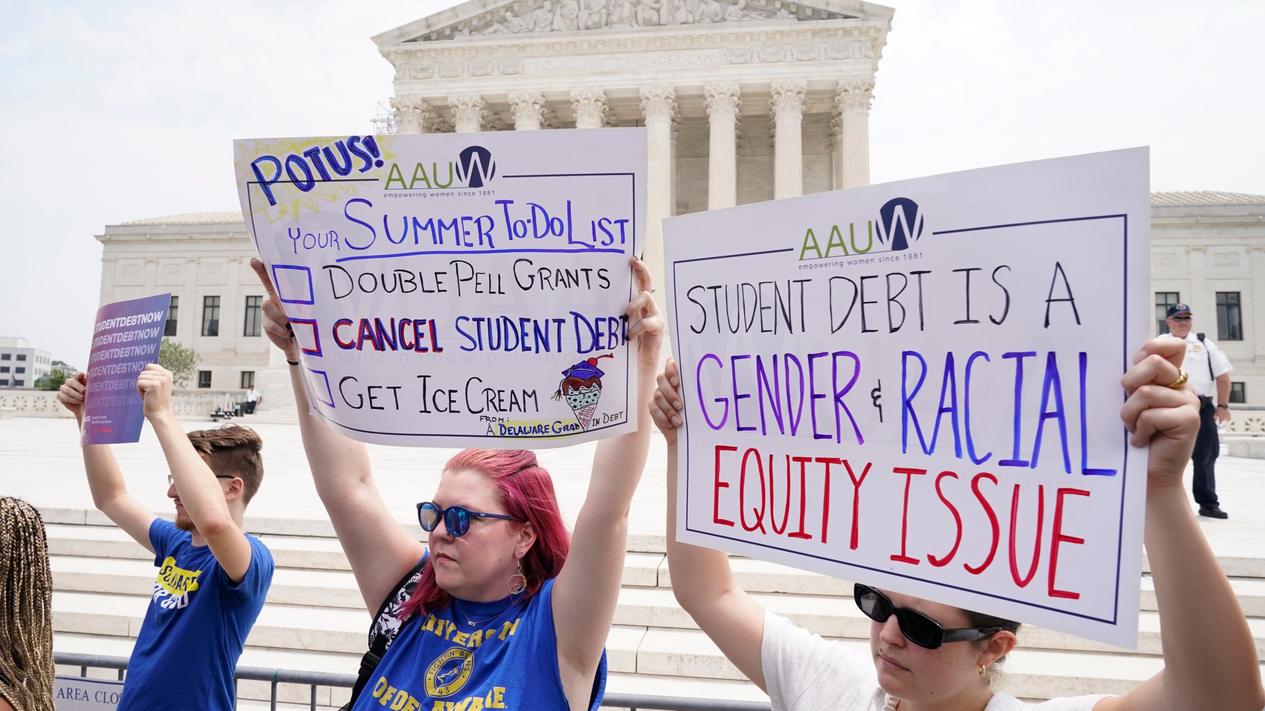 FILE - People demonstrate outside the Supreme Court, June 30, 2023, in Washington. (AP Photo/Jacquelyn Martin, File)