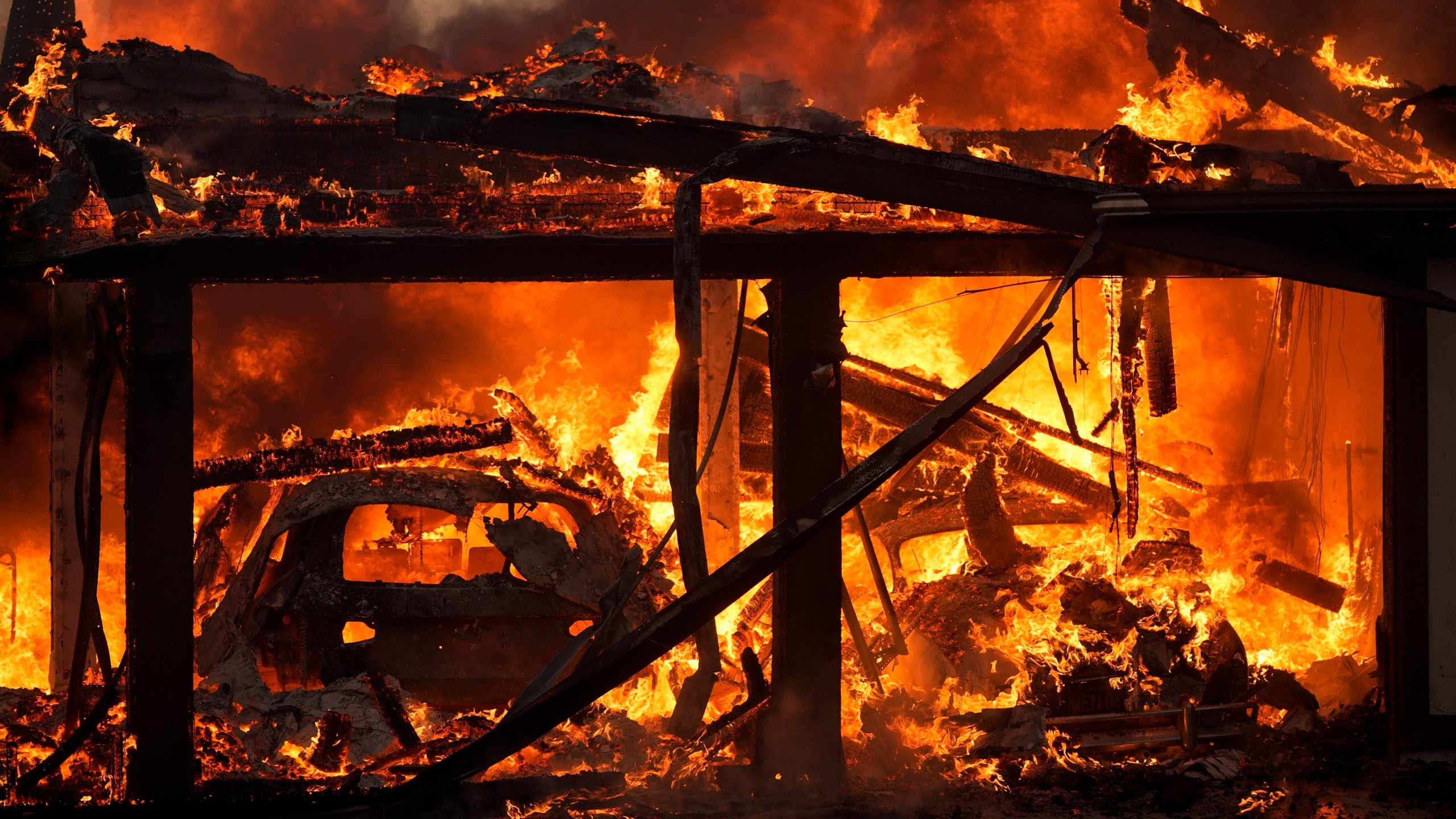 A home burns in the Mountain Fire, Nov. 6, 2024, in Camarillo, Calif. (AP Photo/Marcio Jose Sanchez)