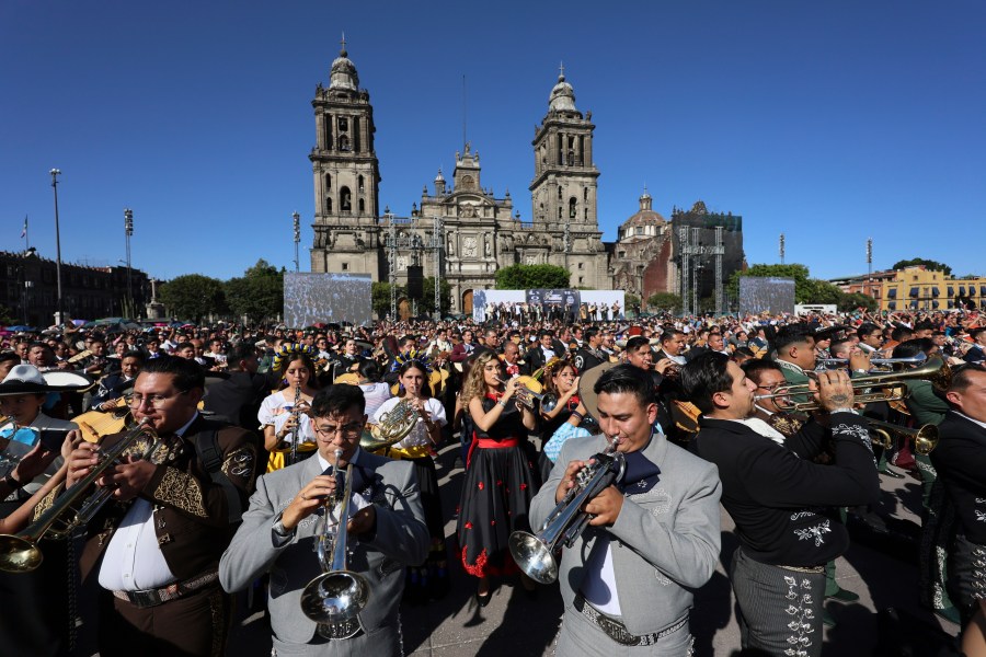 Musicians gather to break the record of most mariachis performing in unison, at the Zocalo, Mexico City's main square, Sunday, Nov. 10, 2024. (AP Photo/Ginnette Riquelme)