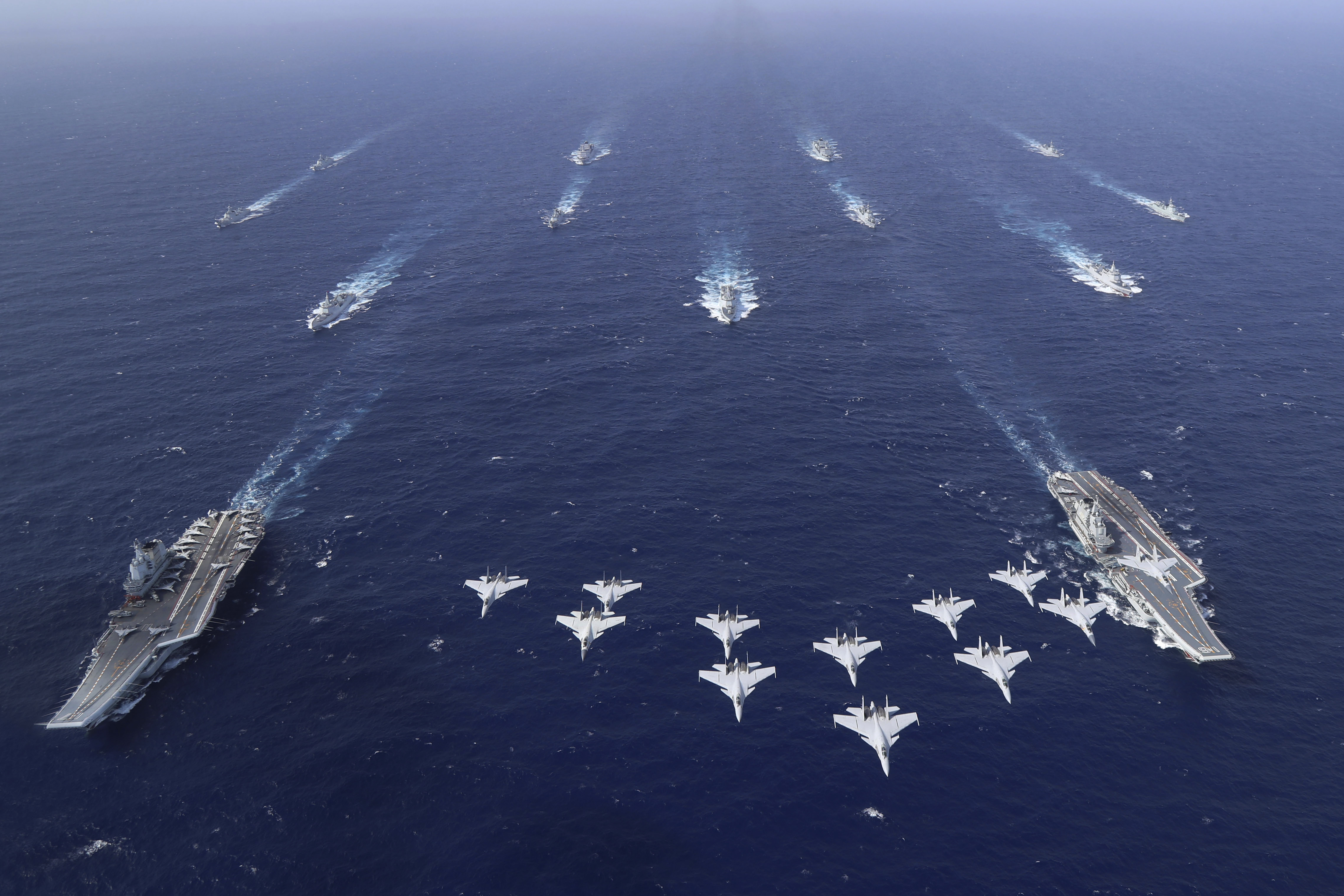 In this photo released by Xinhua News Agency, conventionally powered Chinese aircraft carriers Liaoning and Shandong carry out a dual aircraft carrier formation exercise for the first time in the South China Sea in late October 2024. (Chen Mengxi/Xinhua via AP)