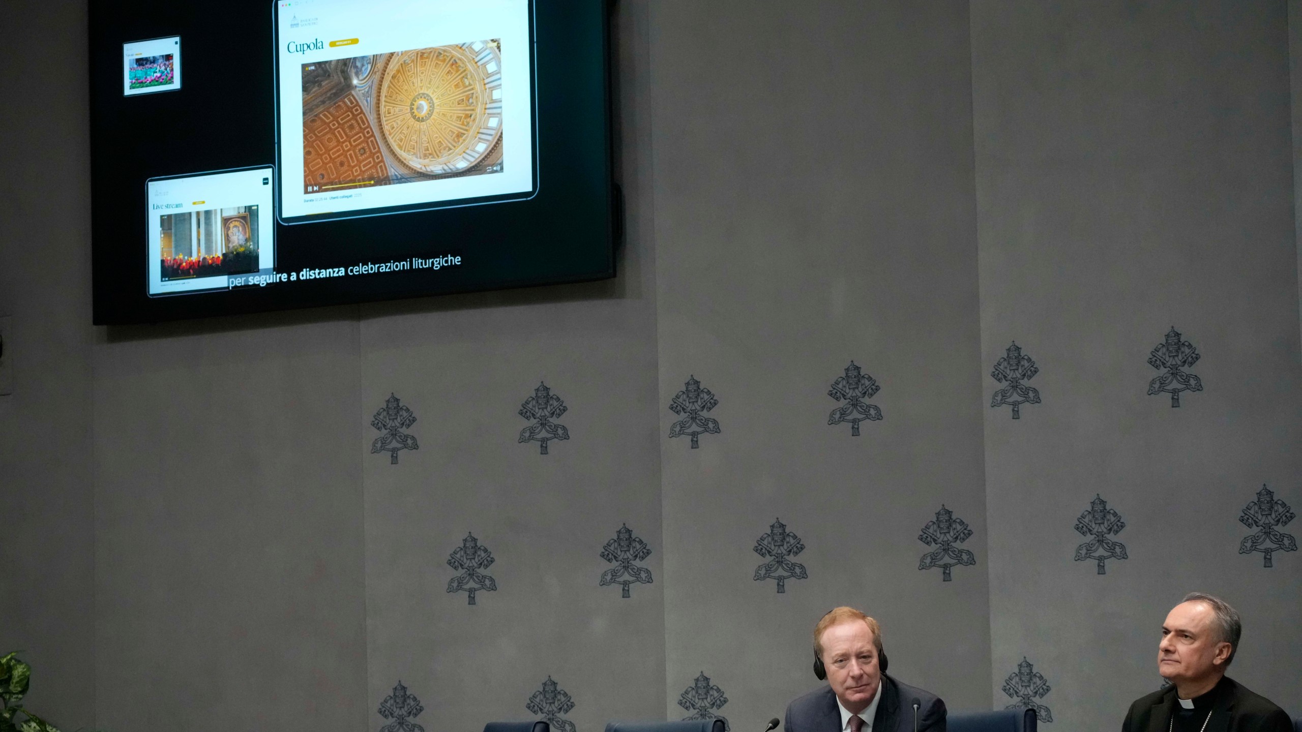 Cardinal Mauro Gambetti, right, and Microsoft's vice-Chairman and President Brad Smith unveil the project "St. Peter's Basilica: AI-Enhanced Experience" during a press conference. at the Vatican, Monday, Nov. 11, 2024. (AP Photo/Gregorio Borgia)