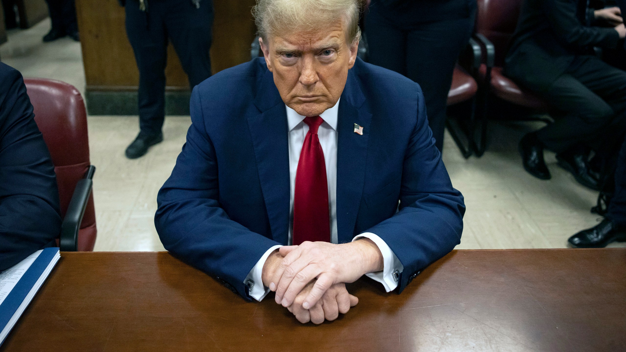 Former President Donald Trump waits for the start of proceedings in Manhattan criminal court, Tuesday, April 23, 2024, in New York. Before testimony resumes Tuesday, the judge will hold a hearing on prosecutors' request to sanction and fine Trump over social media posts they say violate a gag order prohibiting him from attacking key witnesses. (AP Photo/Yuki Iwamura, Pool)