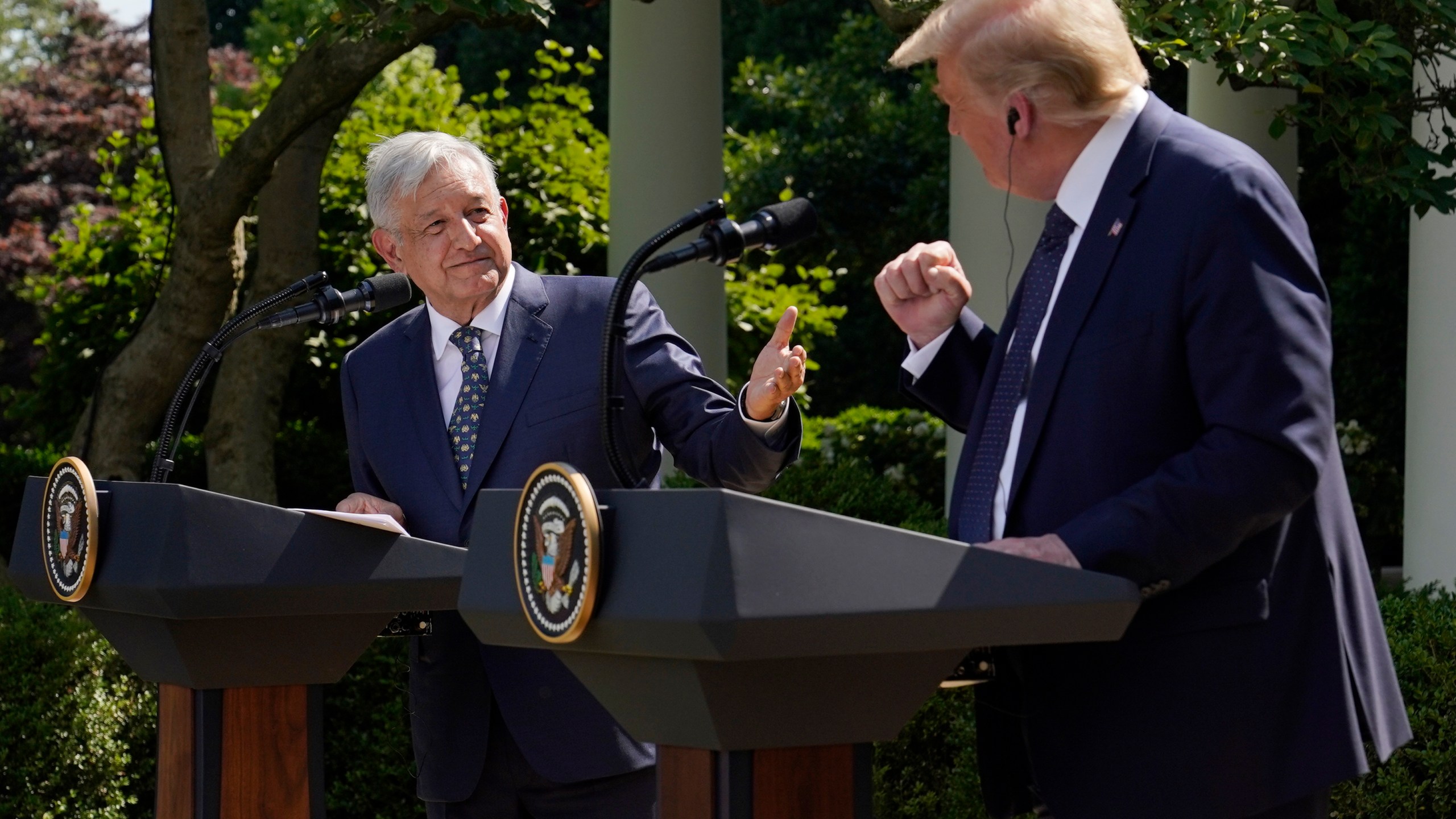 FILE - Mexico's President Andres Manuel Lopez Obrador, left, and President Donald Trump hold a joint news conference at the White House in Washington, July 8, 2020. (AP Photo/Evan Vucci, File)