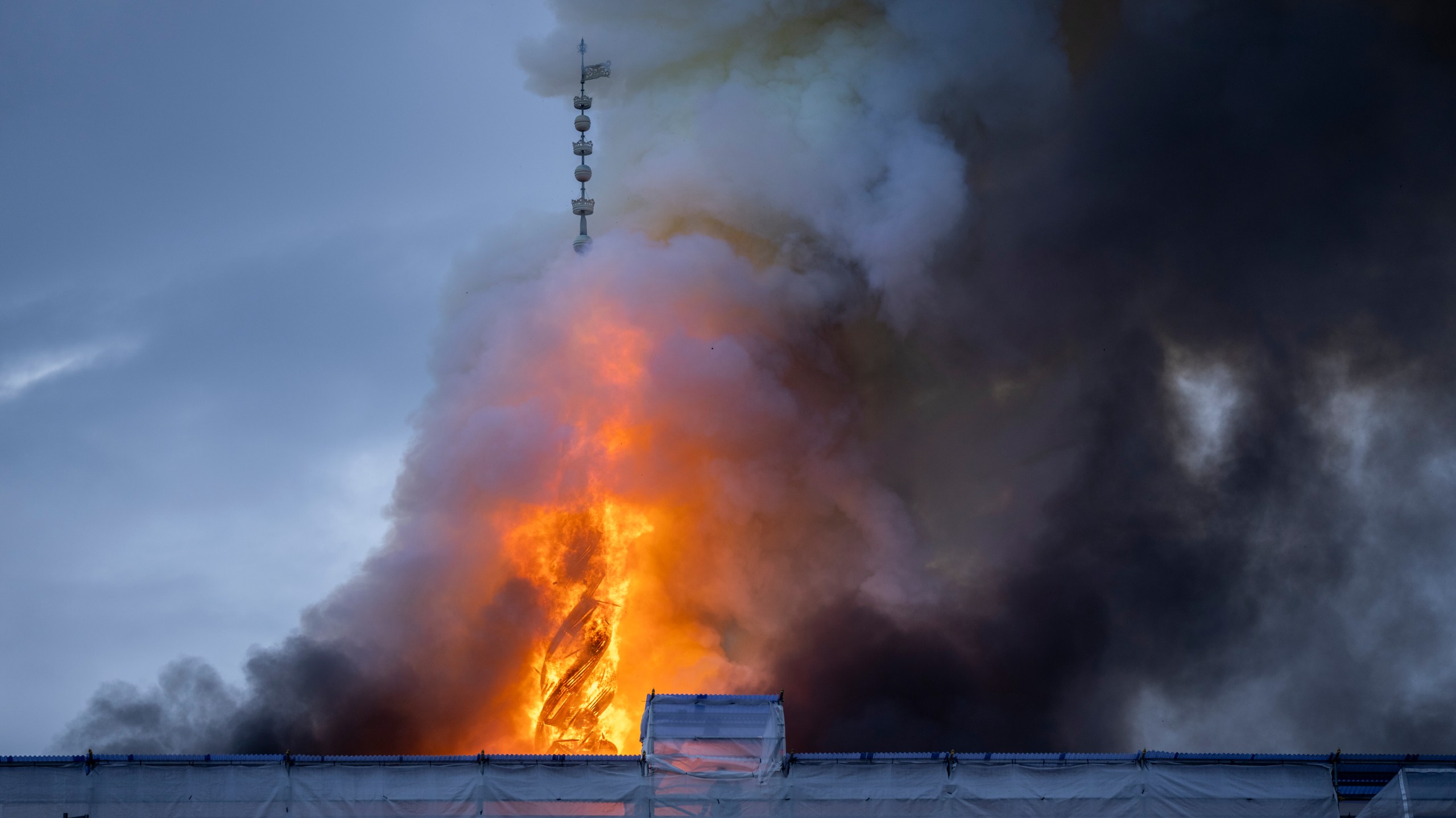 FILE - Fire and smoke rise out of the Old Stock Exchange, Boersen, in Copenhagen, Denmark, Tuesday, April 16, 2024. (Ida Marie Odgaard/Ritzau Scanpix via AP, File)