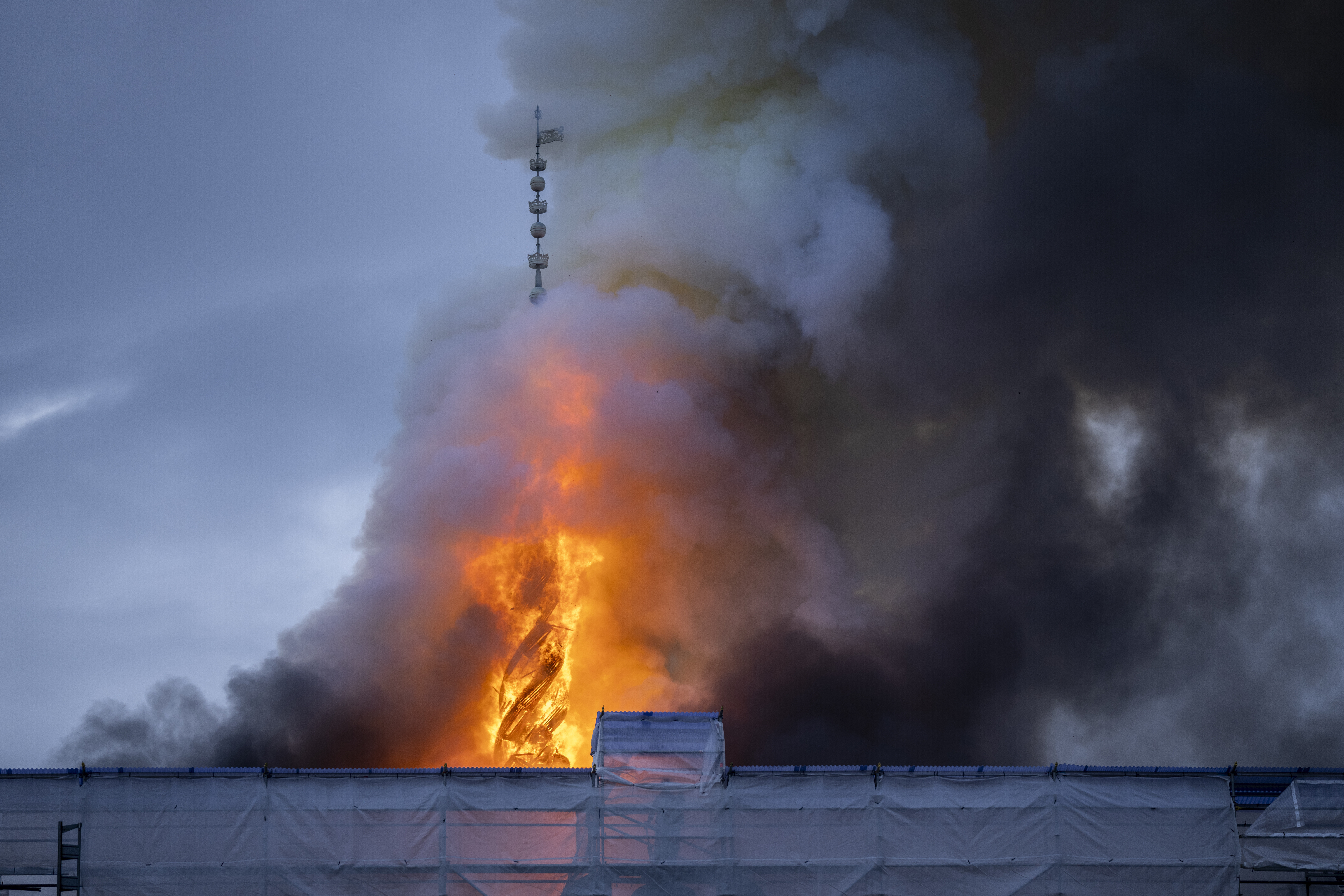 FILE - Fire and smoke rise out of the Old Stock Exchange, Boersen, in Copenhagen, Denmark, Tuesday, April 16, 2024. (Ida Marie Odgaard/Ritzau Scanpix via AP, File)