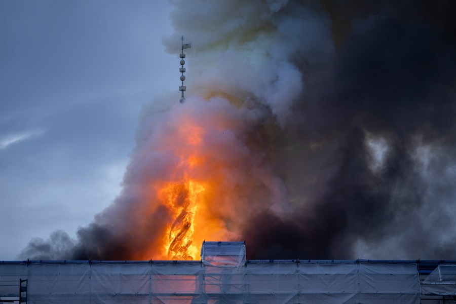 FILE - Fire and smoke rise out of the Old Stock Exchange, Boersen, in Copenhagen, Denmark, Tuesday, April 16, 2024. (Ida Marie Odgaard/Ritzau Scanpix via AP, File)