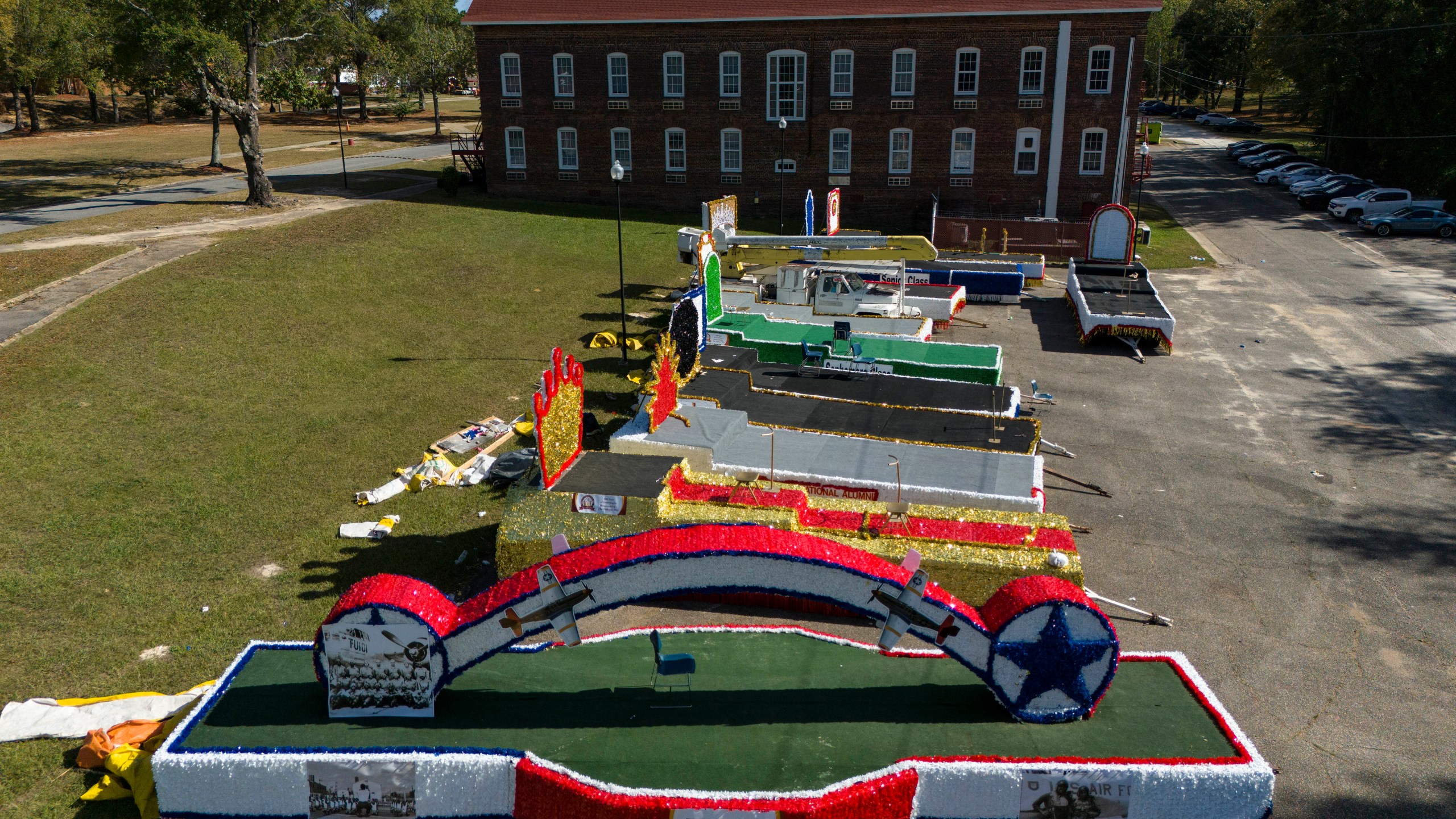 Homecoming parade floats sit on the campus of Tuskegee University a day after a shooting occurred, Monday, Nov. 11, 2024, in Tuskegee, Ala. (AP Photo/Mike Stewart)